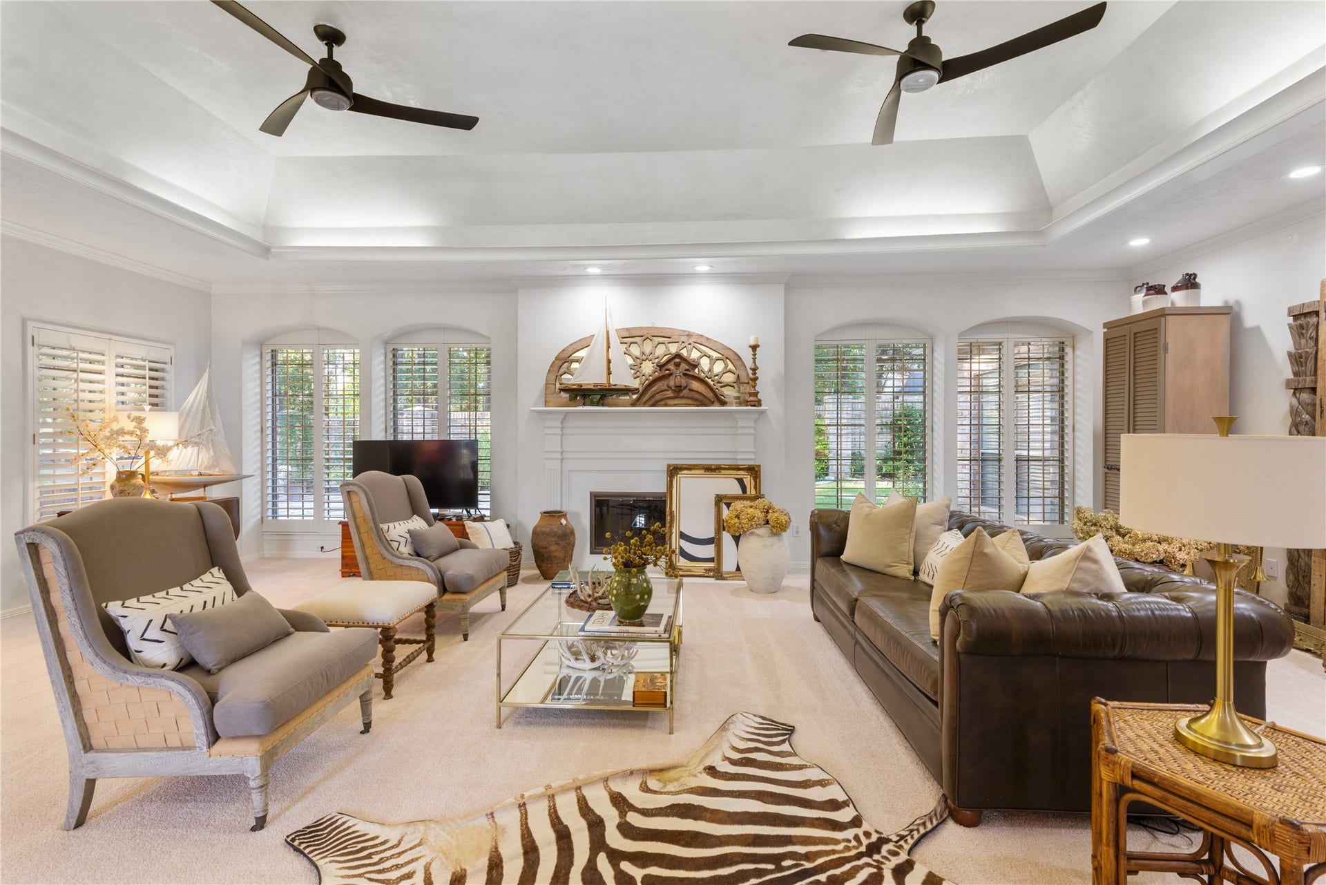 901 Longmire Road, #51, Conroe, TX 77304 Experience heavenly comfort in this gorgeous home, featuring custom wood shutters, smooth plaster walls, recessed lighting, decorative ceiling fans, and a cozy gas log fireplace that adds perfect ambiance.