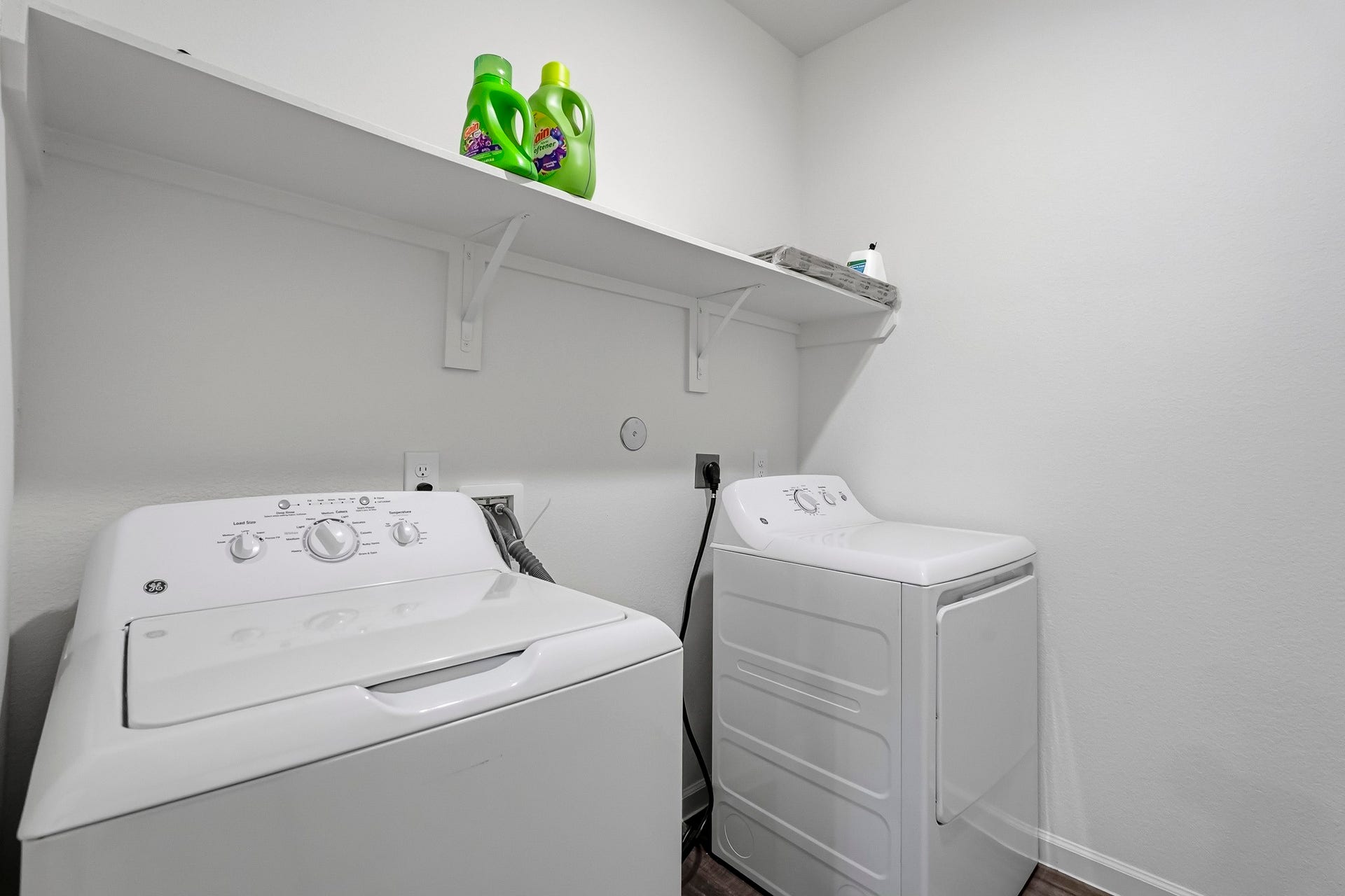21547 Rolling Streams Drive, New Caney, TX 77357 This dedicated laundry room features a clean, functional layout that maximizes the available space while providing an organized area for everyday household tasks.