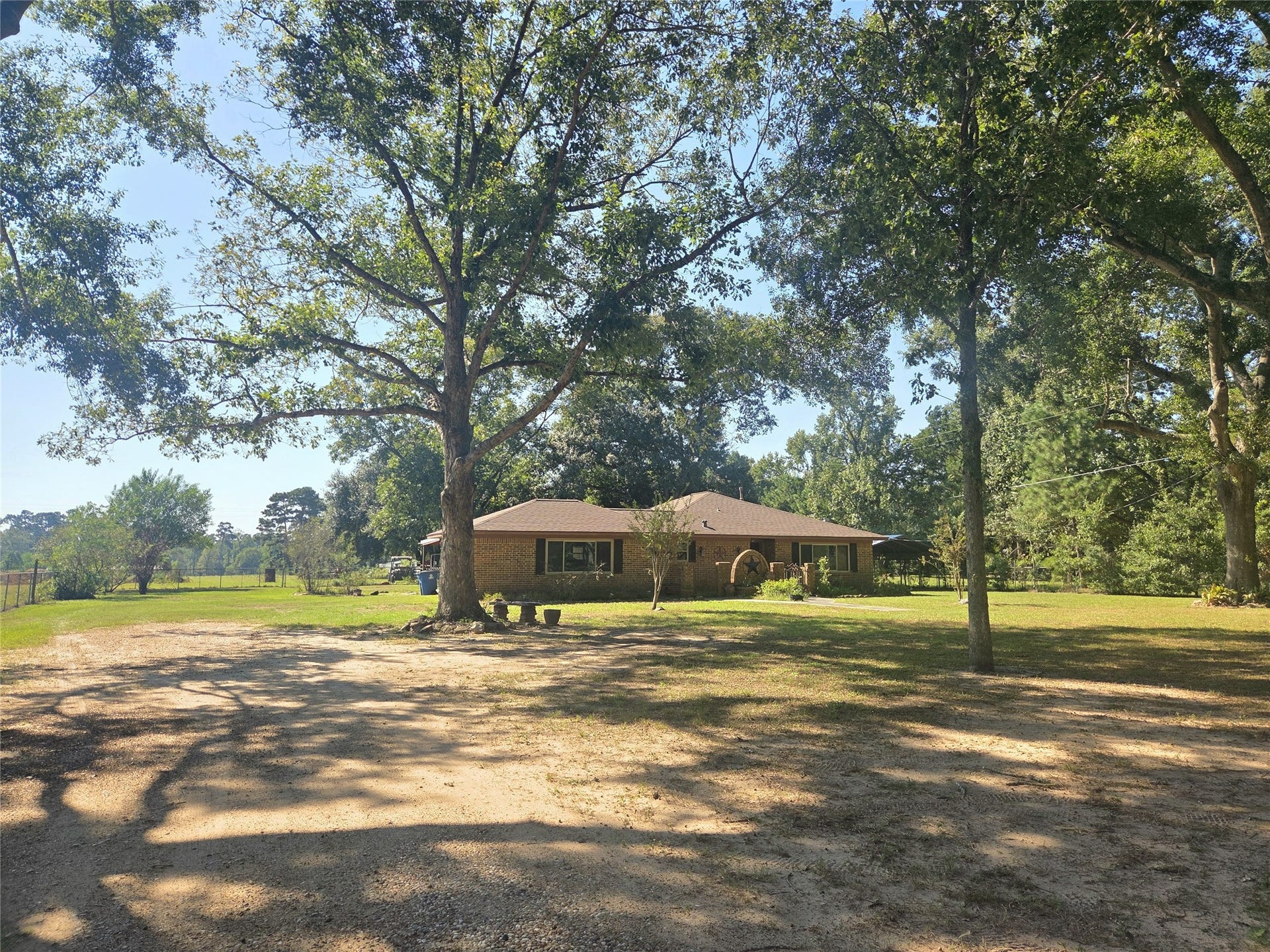 10094 Stidham Road, Conroe, TX 77302 Front of home - newer roof, HVAC, & brand new covered porch with concrete!