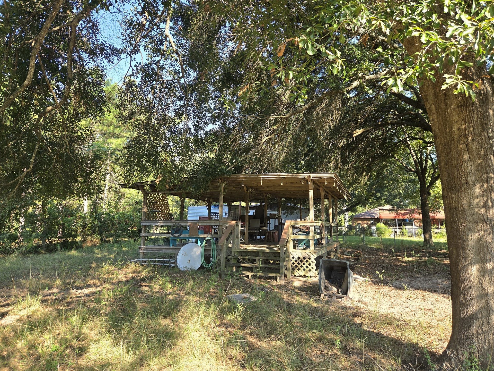 10094 Stidham Road, Conroe, TX 77302 Huge 20x12 Deck that has electric and RV hookups!