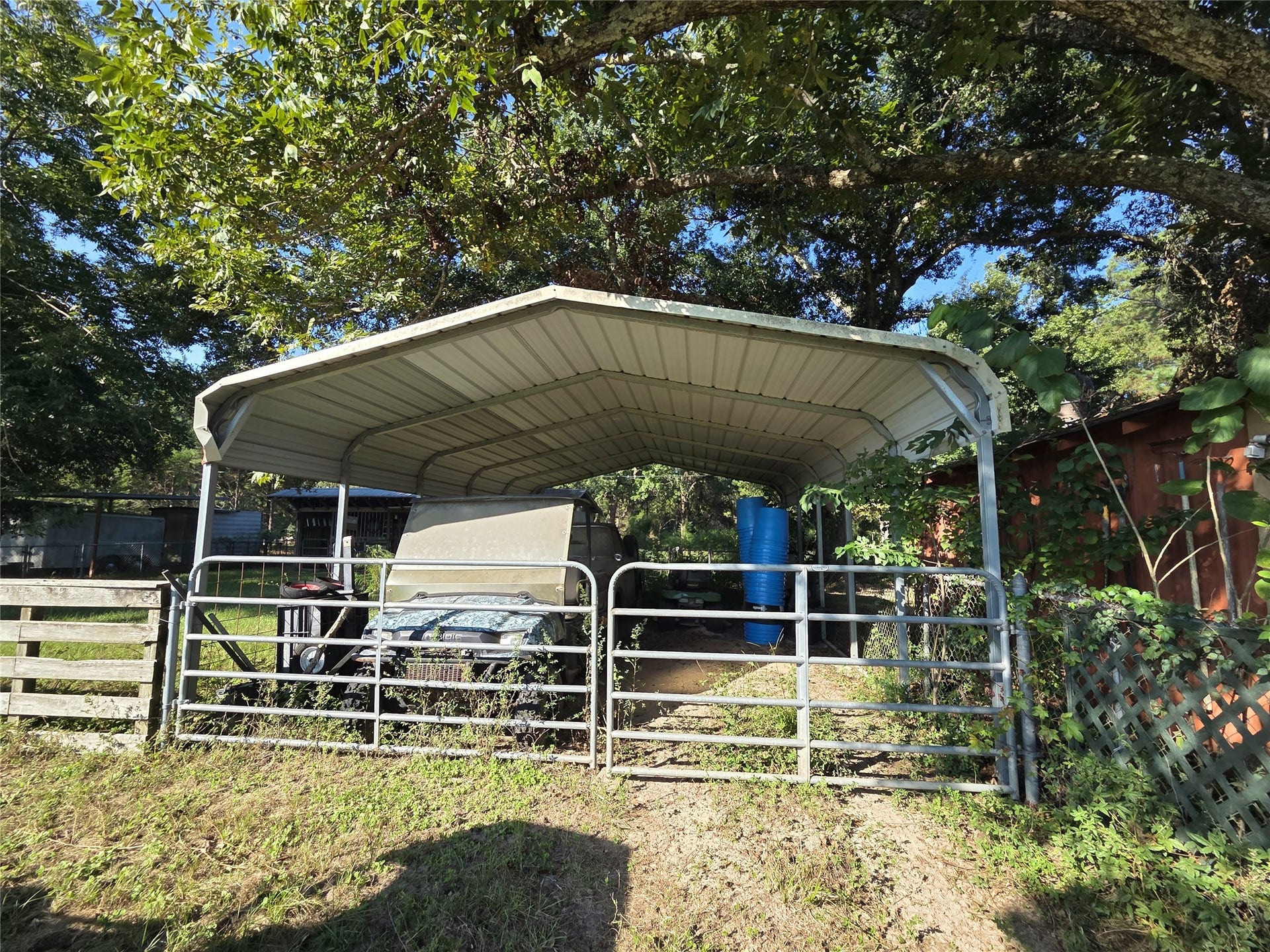 10094 Stidham Road, Conroe, TX 77302 1 of the 2 carports by the pole barn.