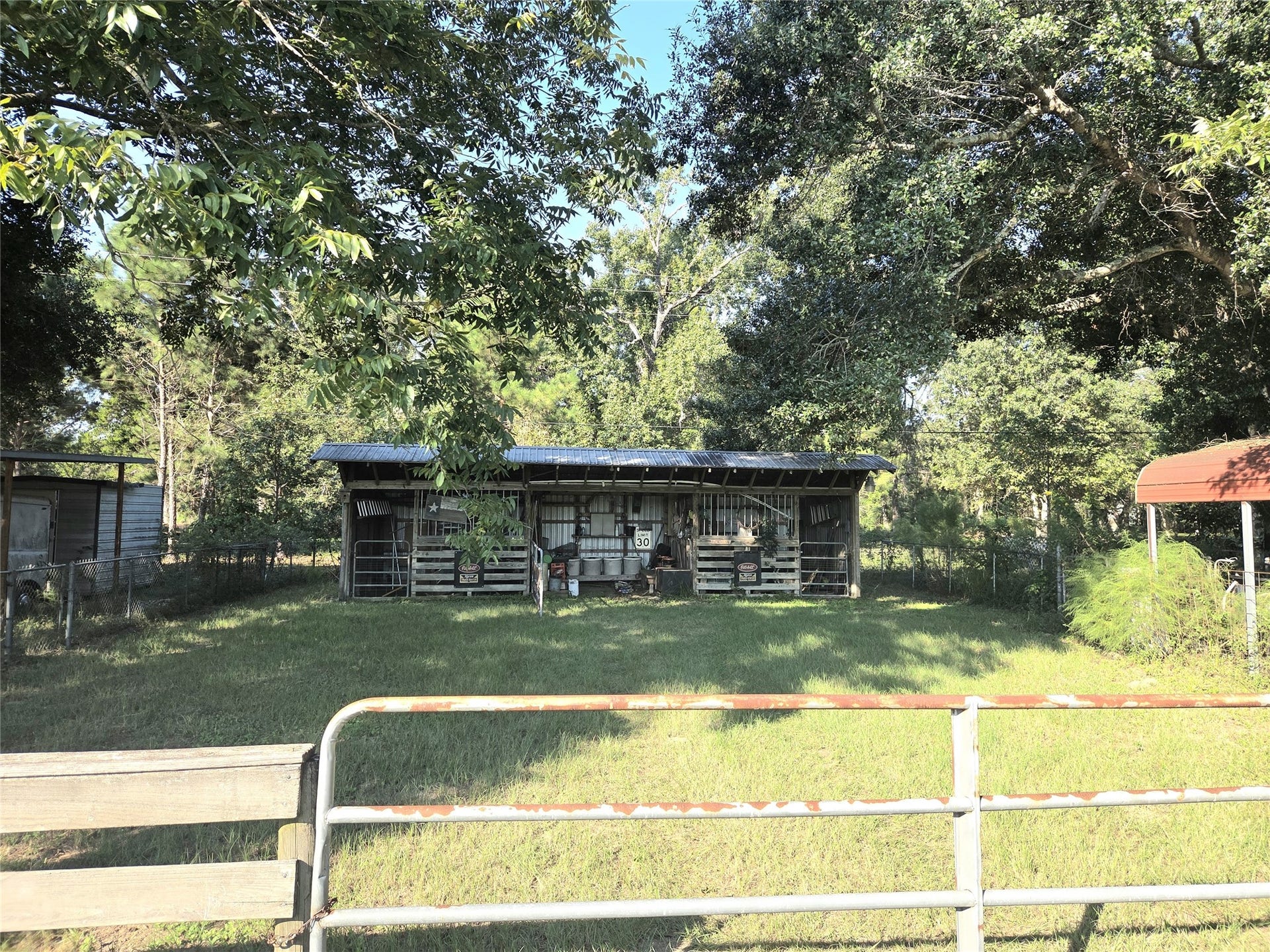 10094 Stidham Road, Conroe, TX 77302 pole barn with 2 stalls and storage space!