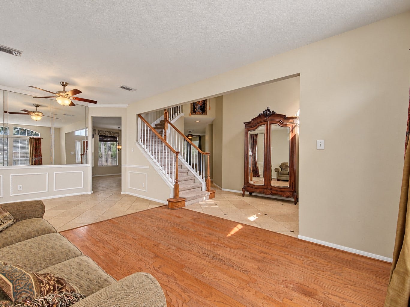 2302 Piney Woods Drive, Pearland, TX 77581 Formal living and dining rooms with wood flooring in the living room and travertine in the dining room