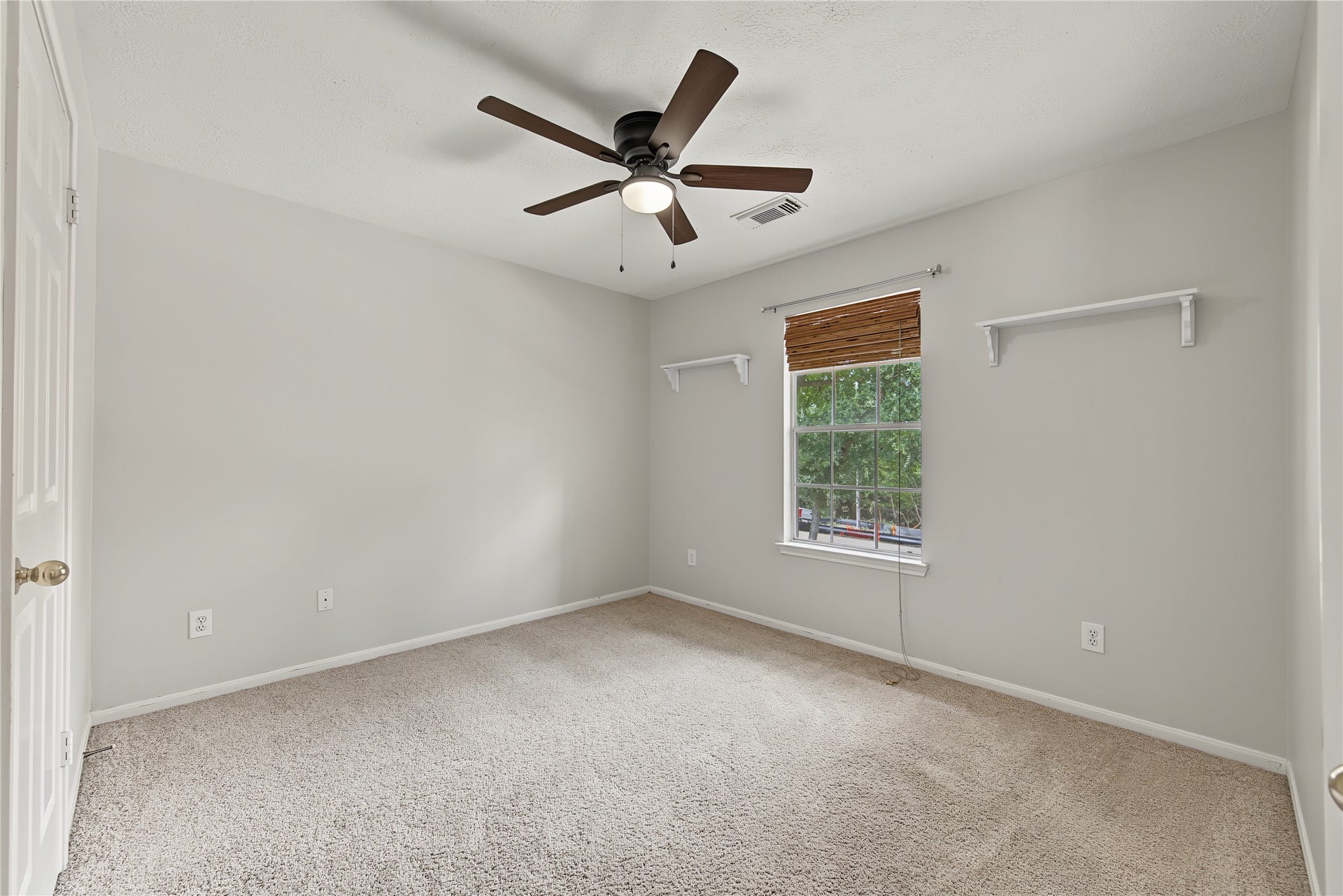 2302 Piney Woods Drive, Pearland, TX 77581 Secondary Bedroom 2 with a ceiling fan, natural light and wall-mounted shelves