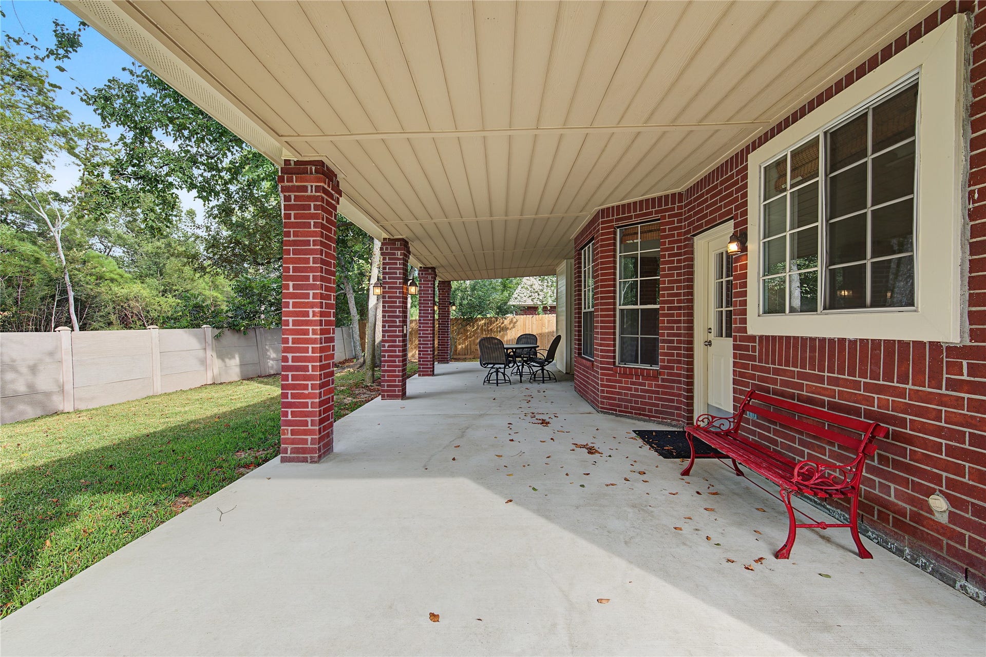 2302 Piney Woods Drive, Pearland, TX 77581 Newly poured 41' x 14' covered patio spans the length of the home, offering plenty of room to relax, dine, and entertain.