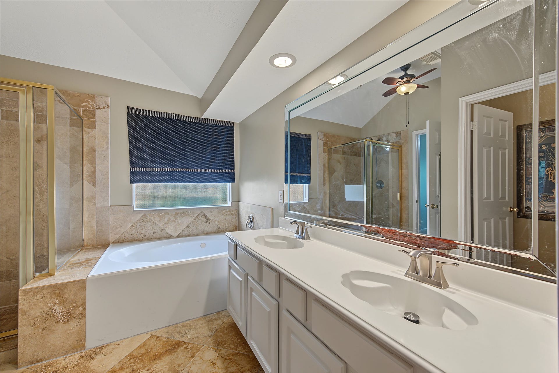 2302 Piney Woods Drive, Pearland, TX 77581 Primary en-suite bath with dual sinks, a jetted tub, and separate glass-enclosed shower