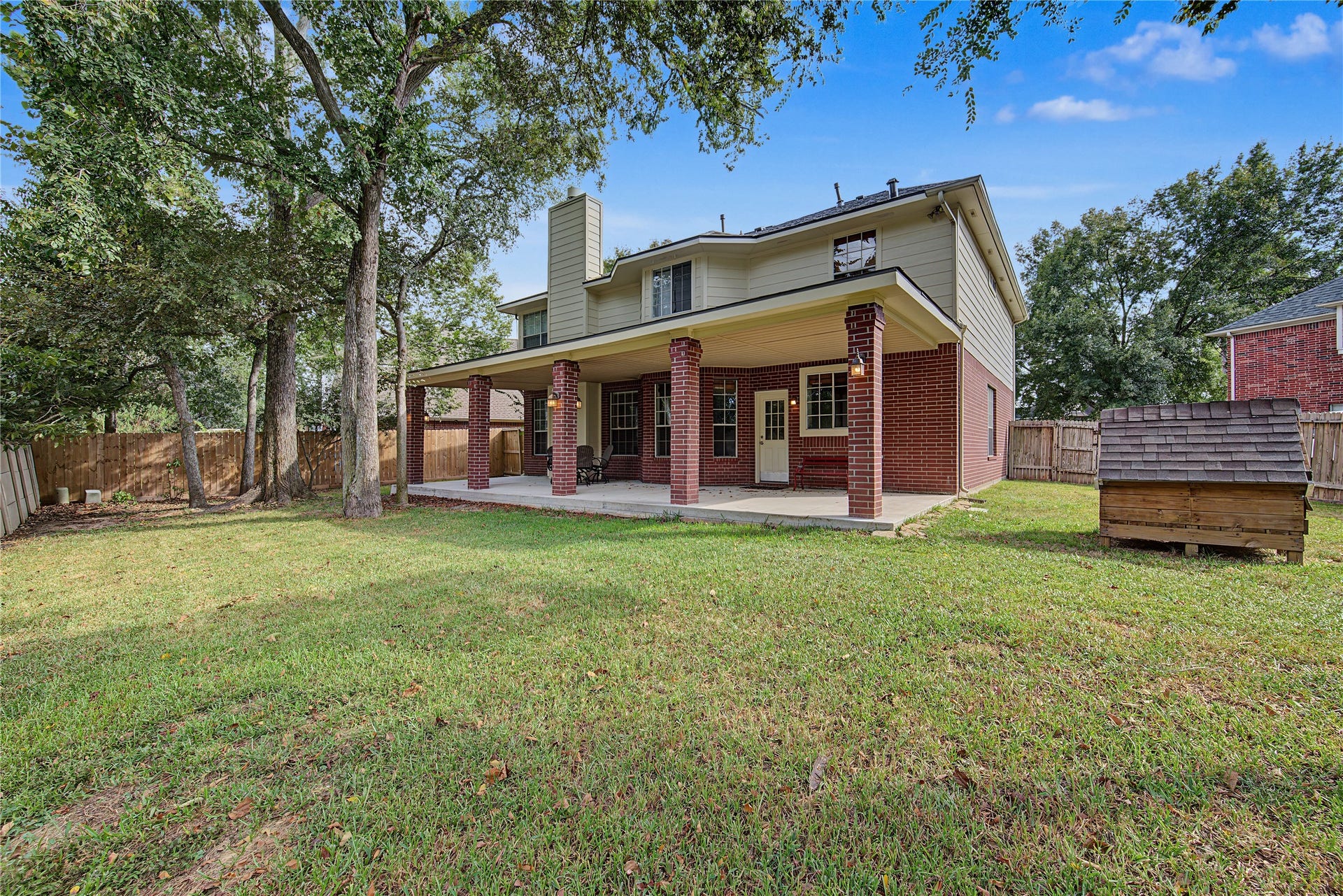 2302 Piney Woods Drive, Pearland, TX 77581 A sweeping view of the home, patio, and backyard