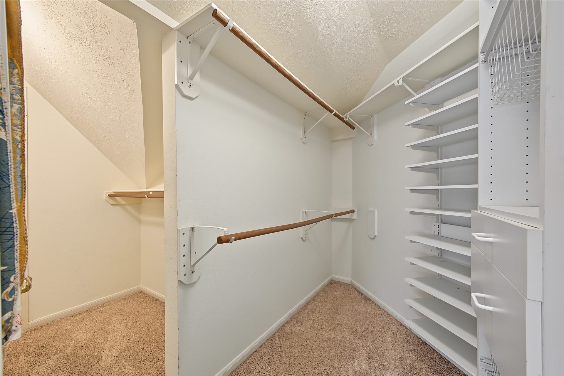 2302 Piney Woods Drive, Pearland, TX 77581 Generous closet space with built-in shelving and access to an additional storage area