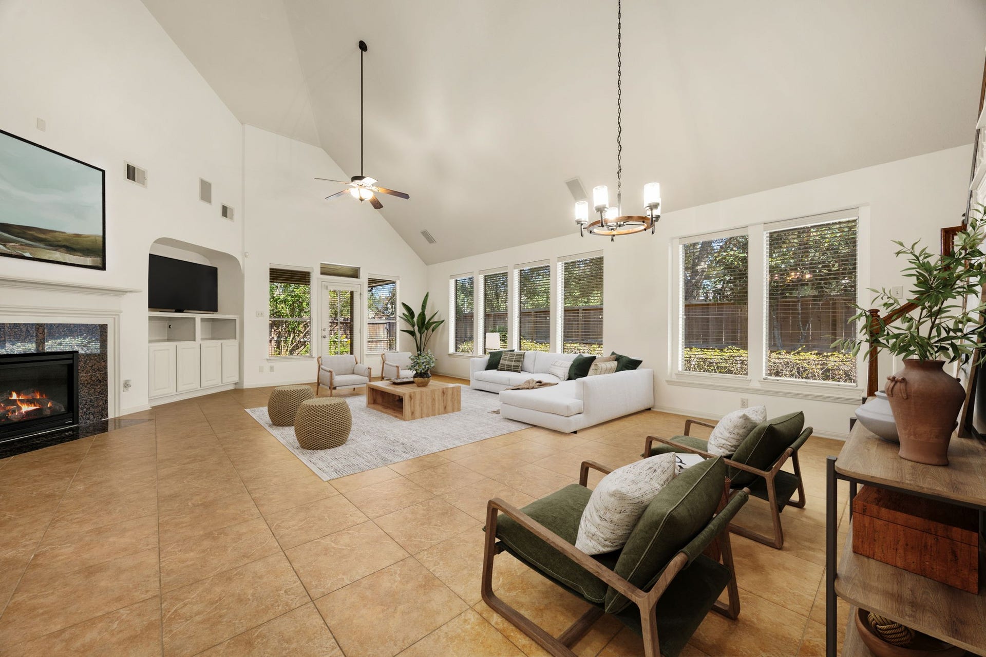 9430 Amethyst Arbor Lane, Katy, TX 77494 Step into the heart of the home, a magnificent family room where towering vaulted ceilings and an impressive wall of windows create an airy, light-filled sanctuary. *Virtually Staged
