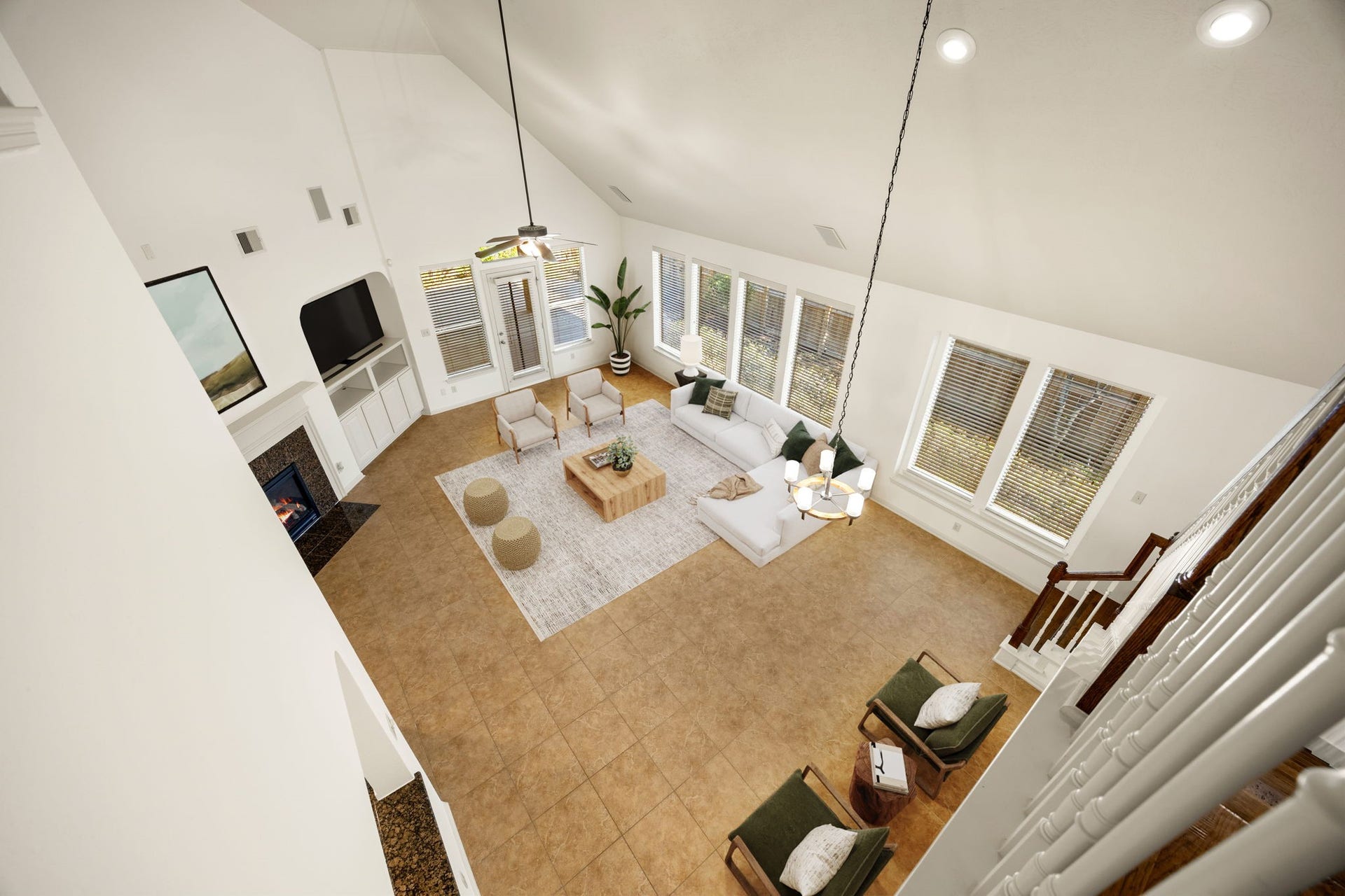 9430 Amethyst Arbor Lane, Katy, TX 77494 This stunning bird's-eye view from the upper balcony highlights the grand proportions and impressive architectural scale of the main living space. *Virtually Staged