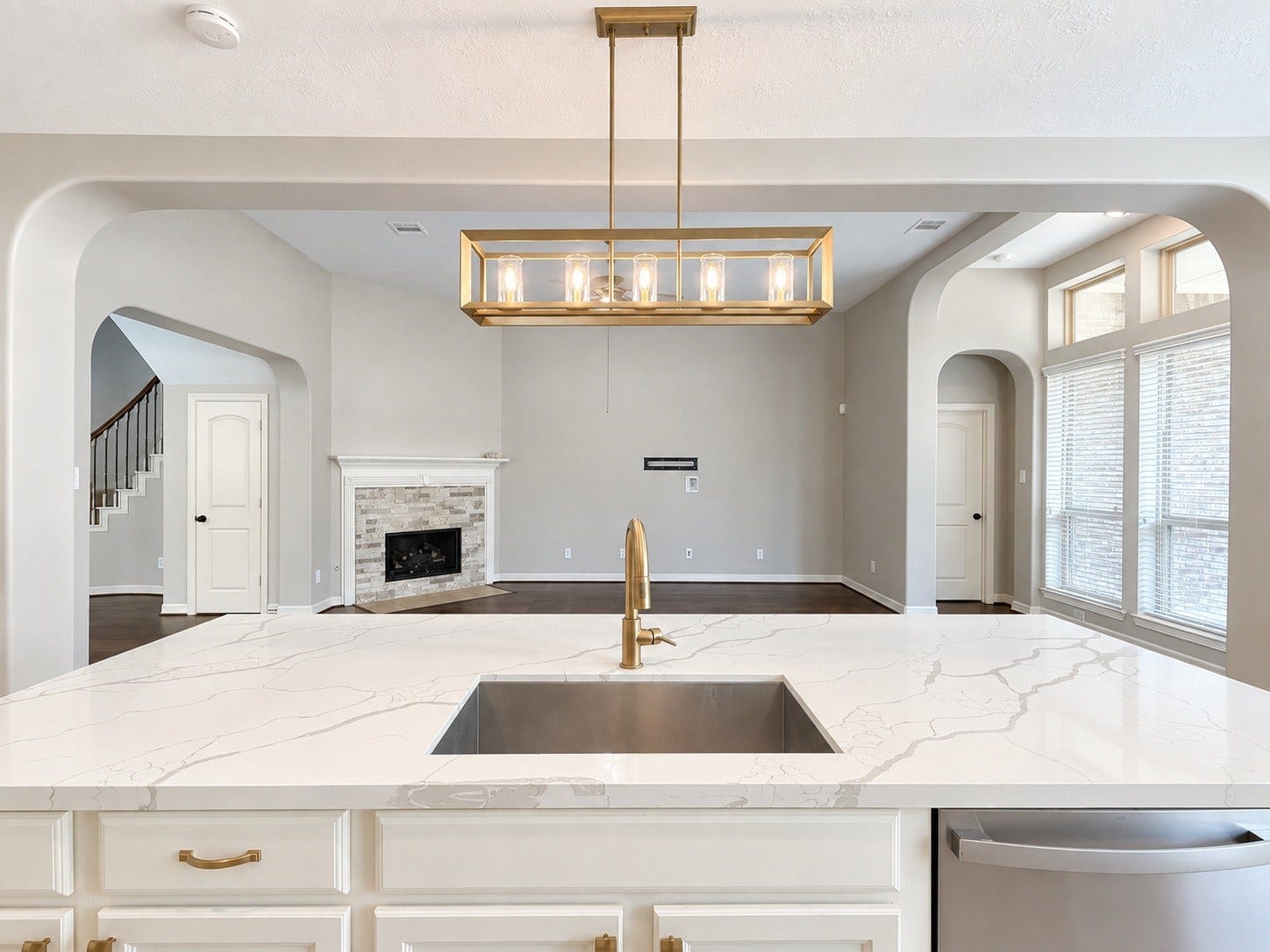 Designed for effortless entertaining, the open-concept kitchen and living room flow beautifully together, creating a welcoming gathering space at the heart of the home.