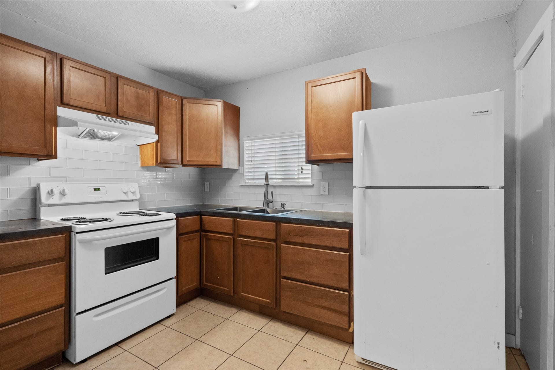 4808 35th Street E, Dickinson, TX 77539 Spacious kitchen with electric stove and ceramic tile flooring