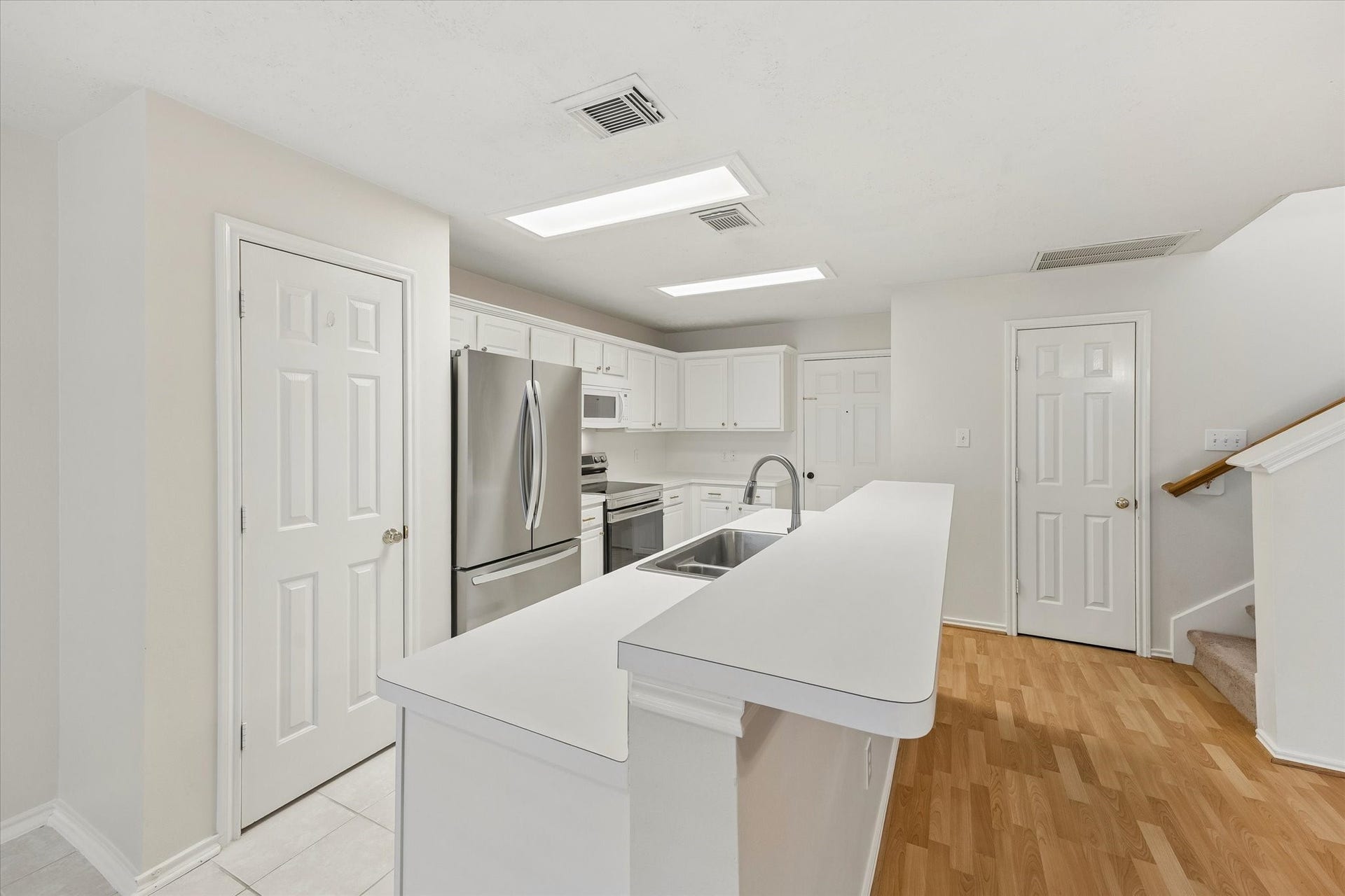 139 Anise Tree Place, Spring, TX 77382 kitchen features a pantry, stainless steel refrigerator and oven, breakfast bar and dishwasher.
