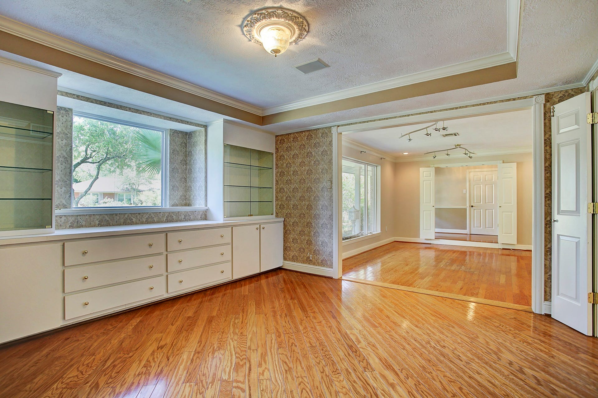 Dinner parties deserve a proper setting. The dining room connects to the front living area, with built-in storage ready for the good dishes.
