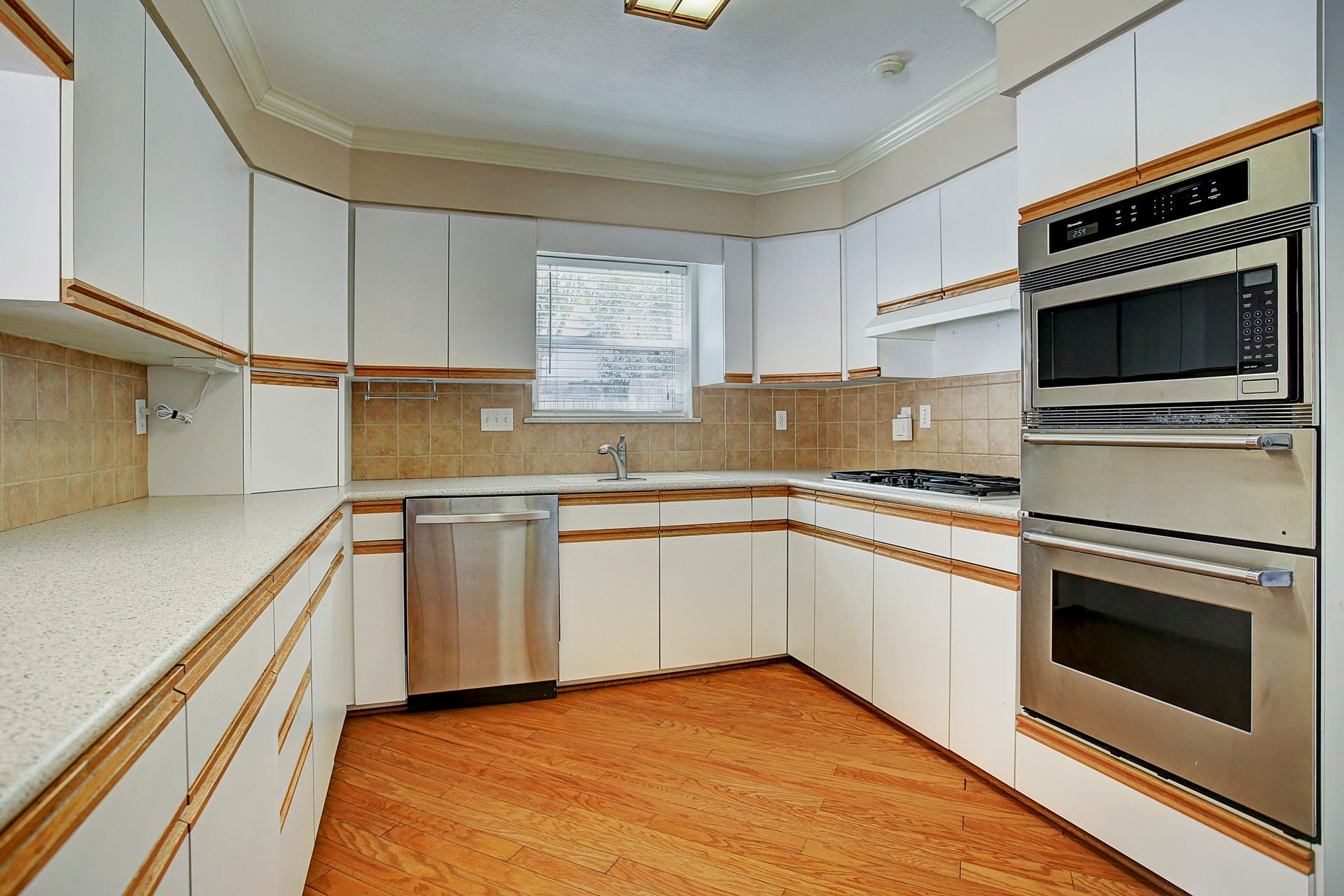 Cabinets and drawers wrap around the kitchen, keeping cookware close and counters ready for whatevers on the menu.
