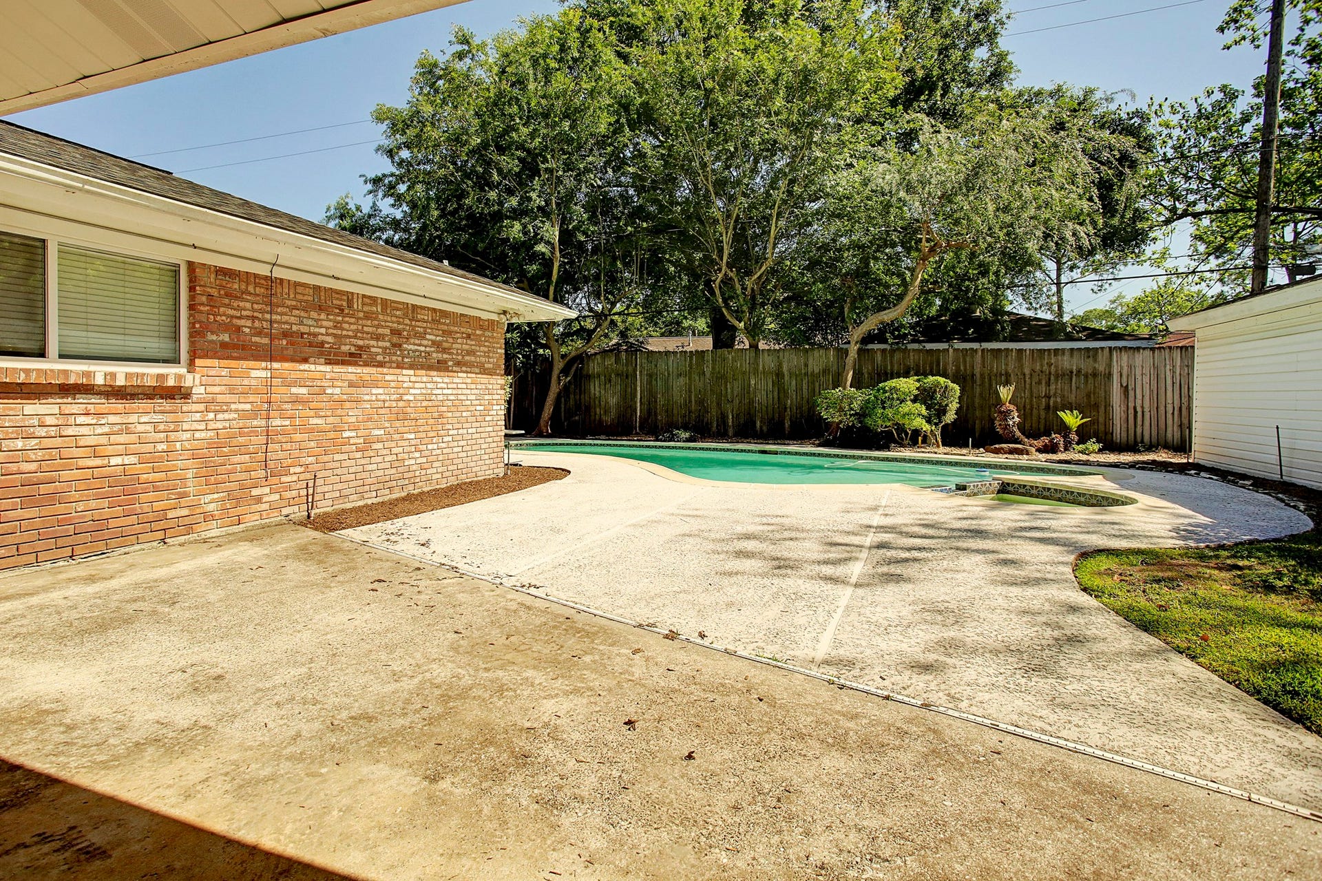 Bring the loungers and the grill. The covered patio and broad pool deck give you room to make a whole day of being outside.
