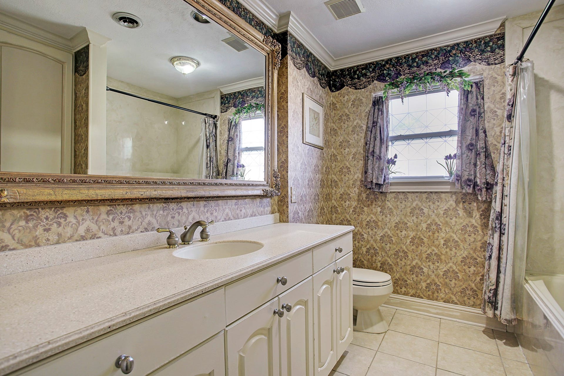 A generous bathroom counter means your skincare routine doesnt have to negotiate for space, with storage below for the extras.