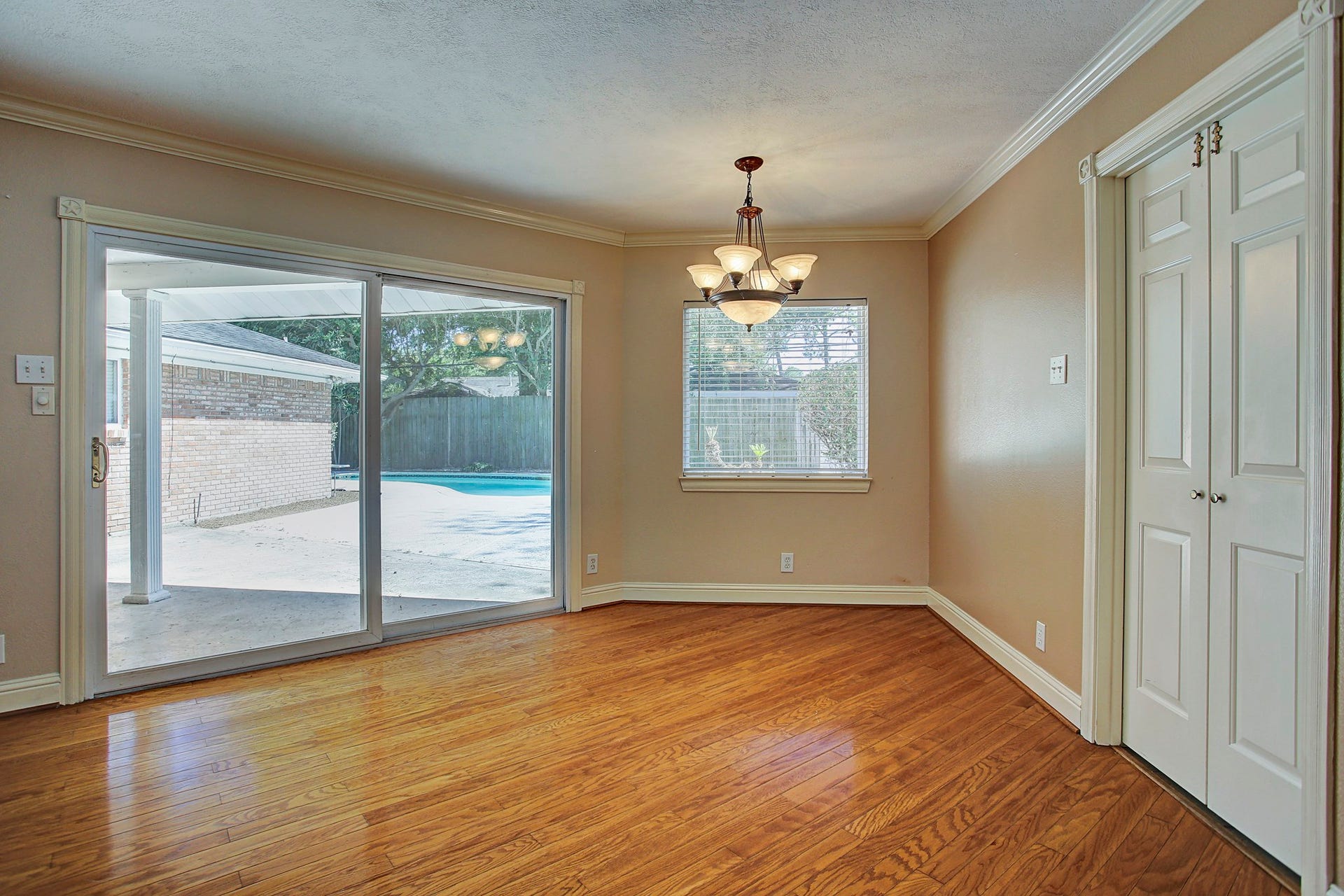 Coffee with a pool view. The breakfast area opens directly to the covered patio for easy mornings inside or out.