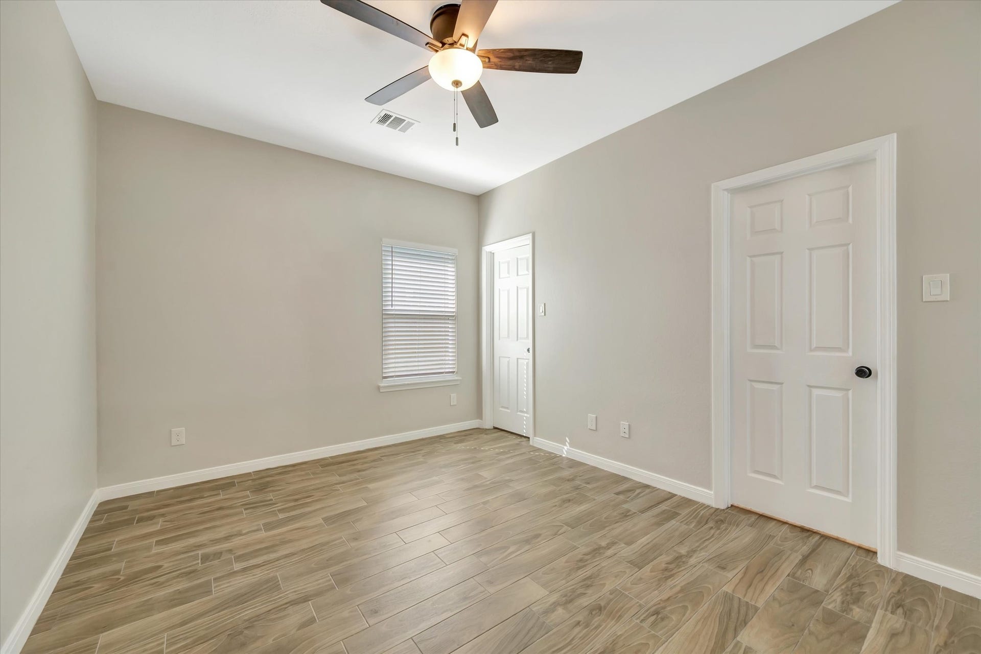 Primary Bedroom wih Ceiling Fan and Walk-in Closet (Ceiling sheetrock recently replaced)