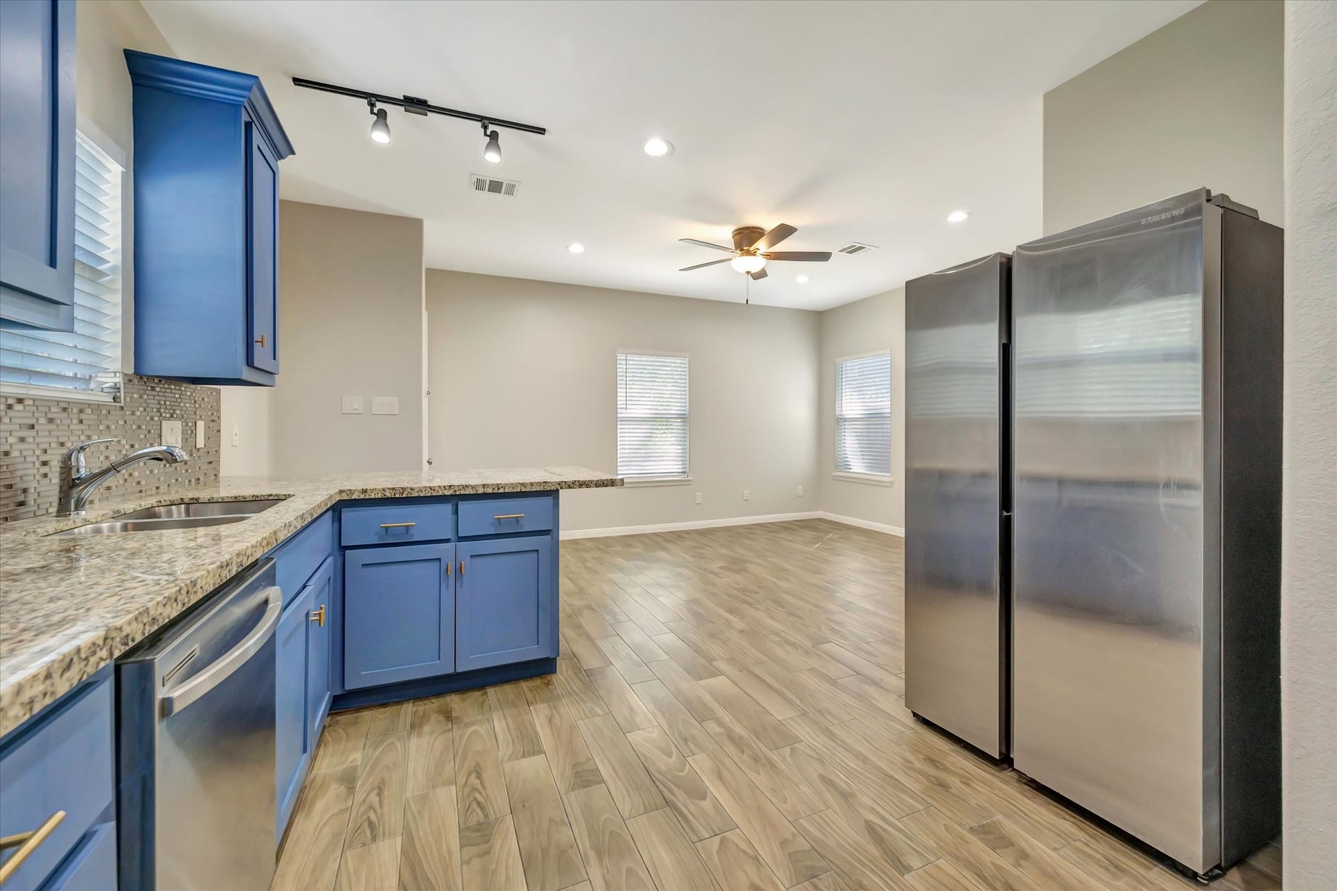View looking into Living Area and Side-by-Side Refrigerator
