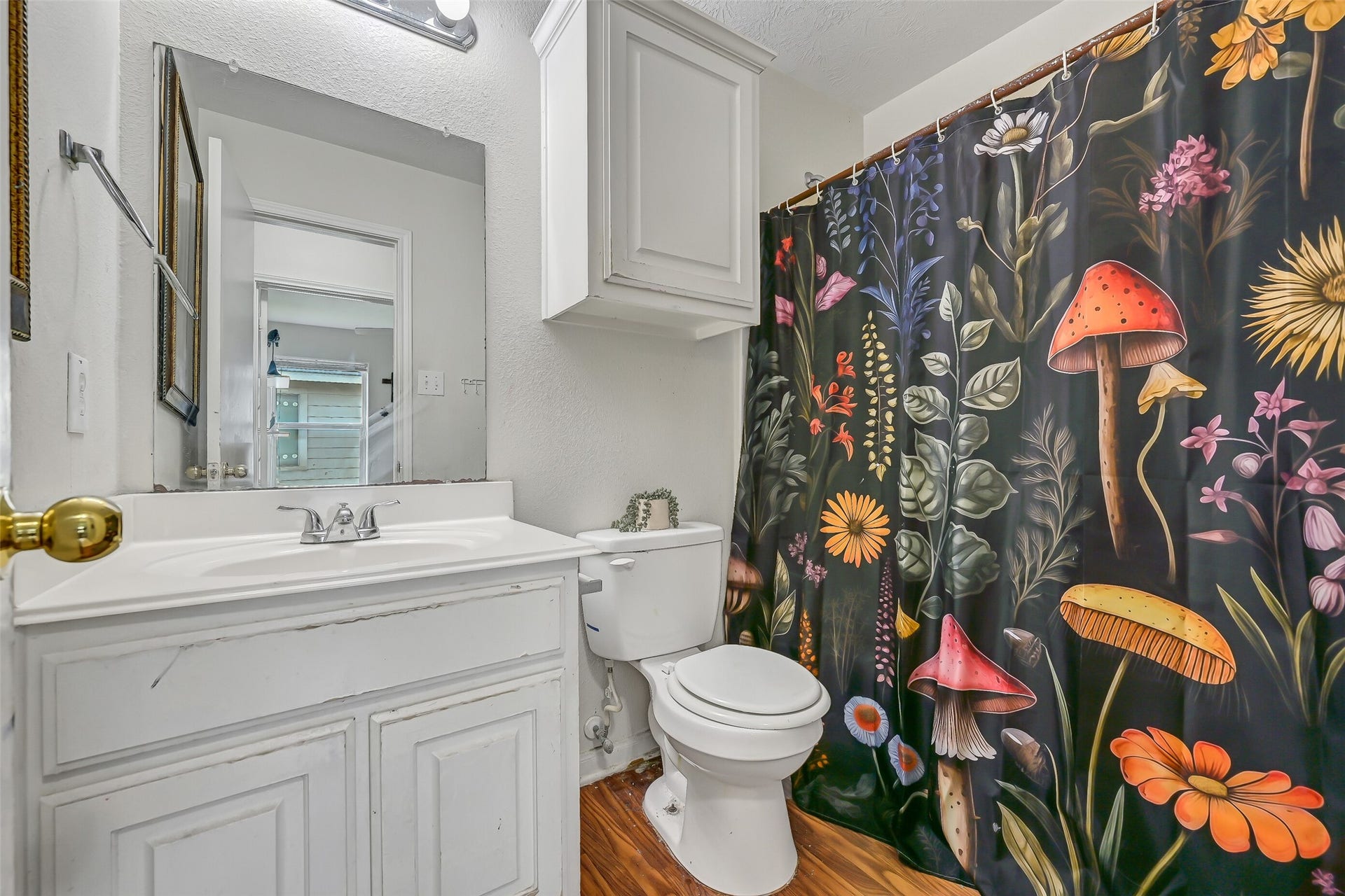 9022 Amberjack Drive, Texas City, TX 77591 The second full bath includes a vanity with storage, large wall mirror, tub/shower combination, and additional upper cabinetry.