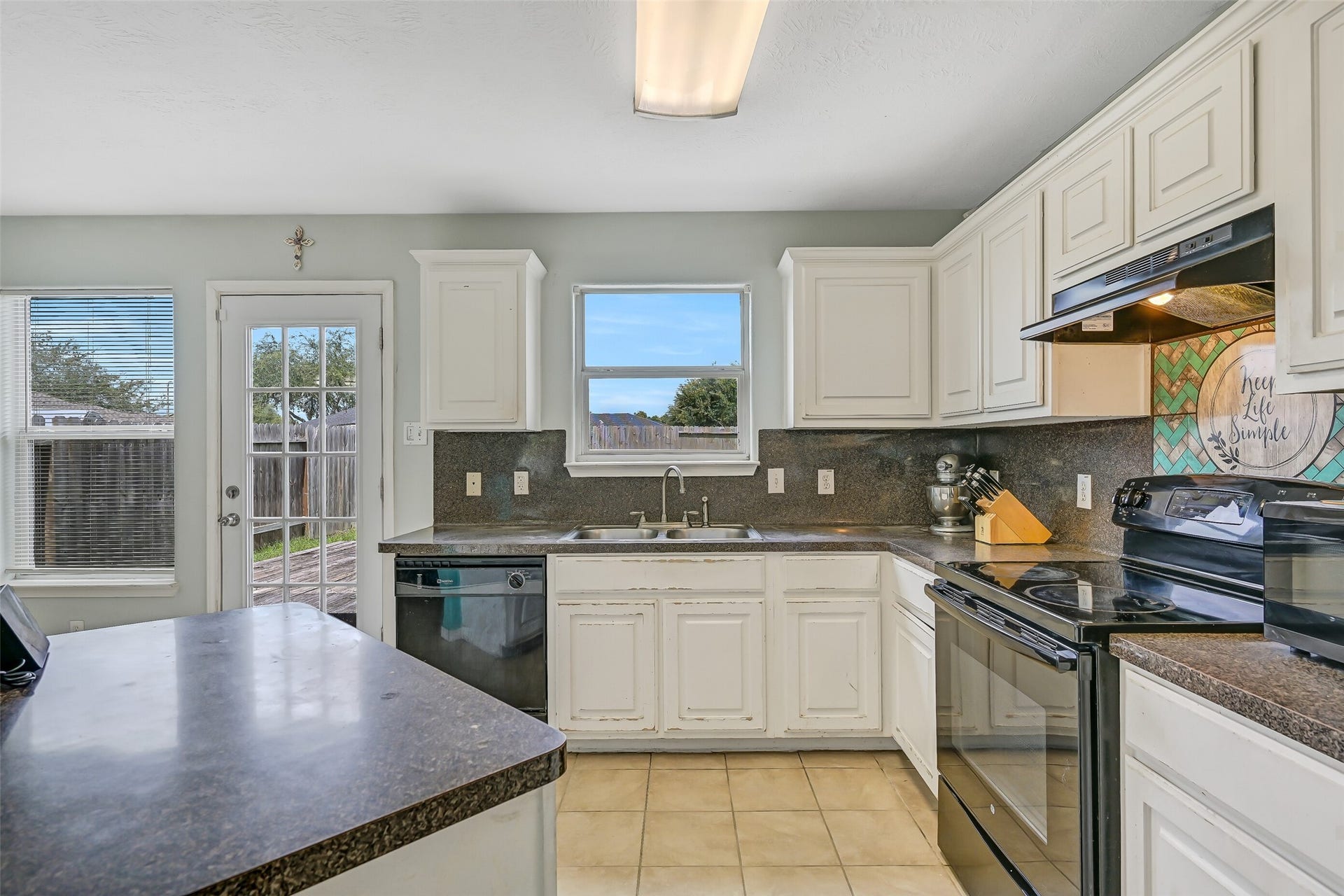 9022 Amberjack Drive, Texas City, TX 77591 The kitchen's open design keeps the cook connected to the surrounding living and dining spaces, with a generously sized breakfast bar providing additional serving or casual dining space.