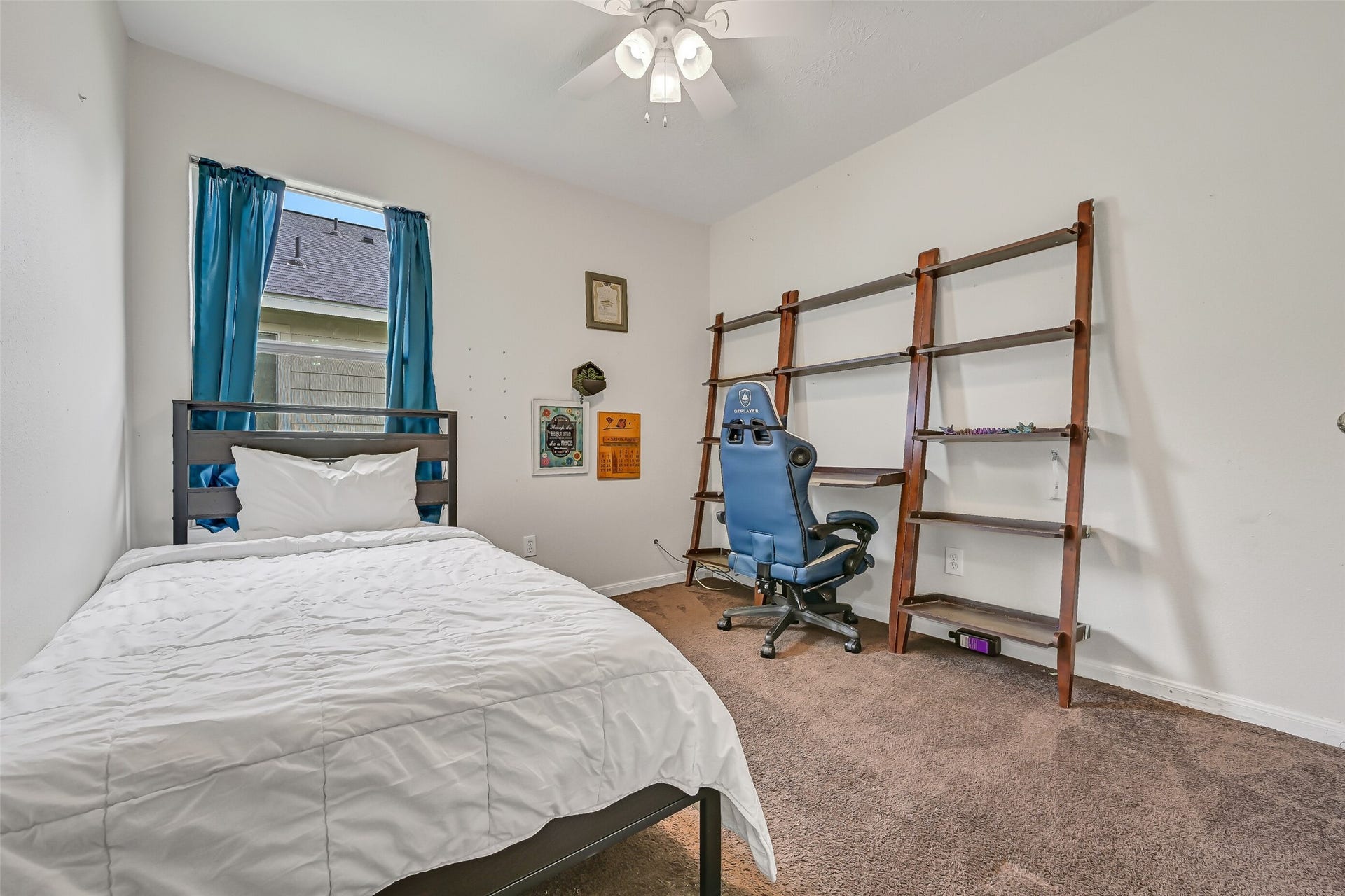 9022 Amberjack Drive, Texas City, TX 77591 The third bedroom provides comfortable space for bedroom furnishings along with a ceiling fan and window for natural light.