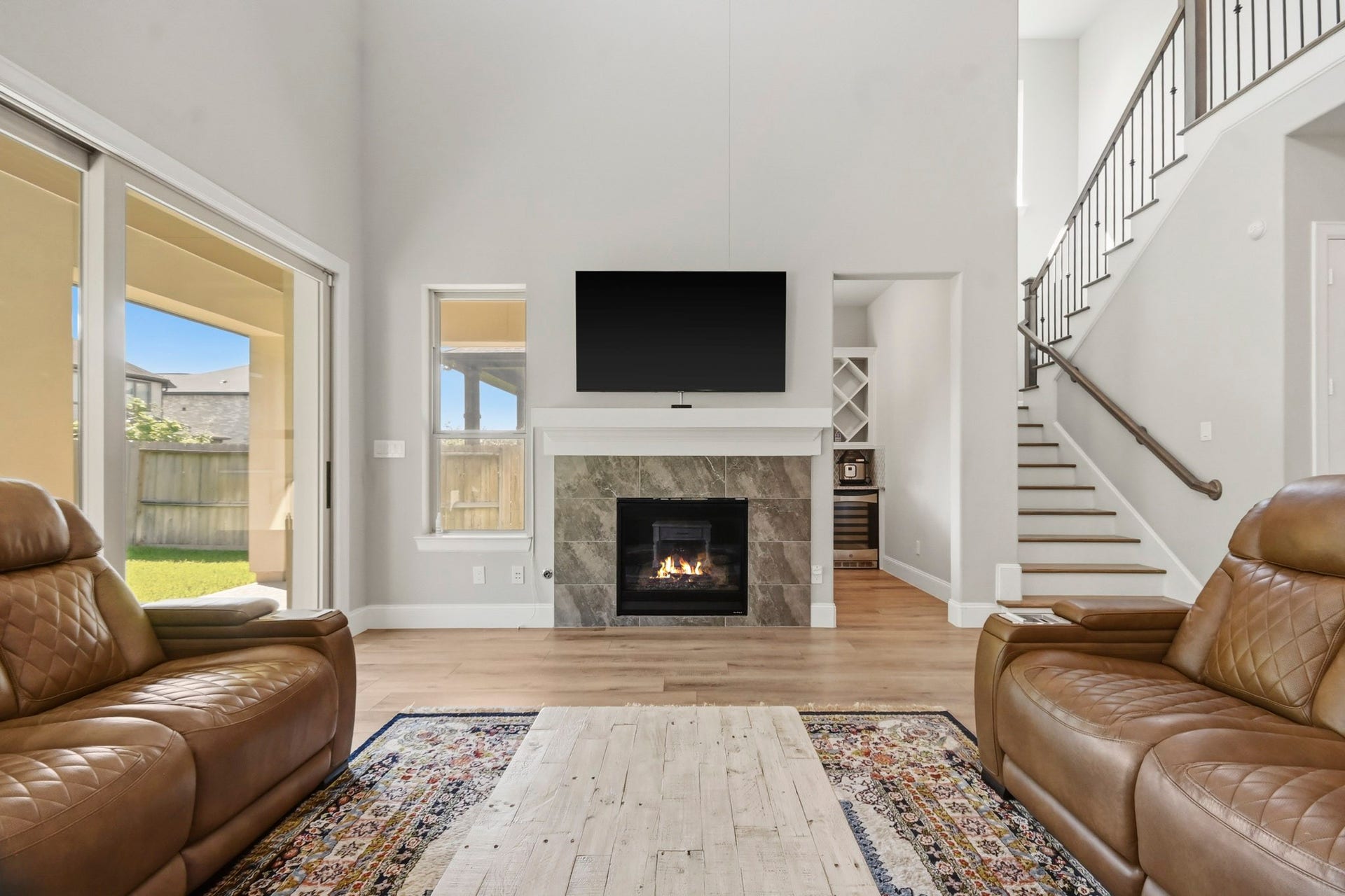 2511 Park Square Drive, Missouri City, TX 77459 Open-concept living area featuring a gas fireplace and spacious layout.