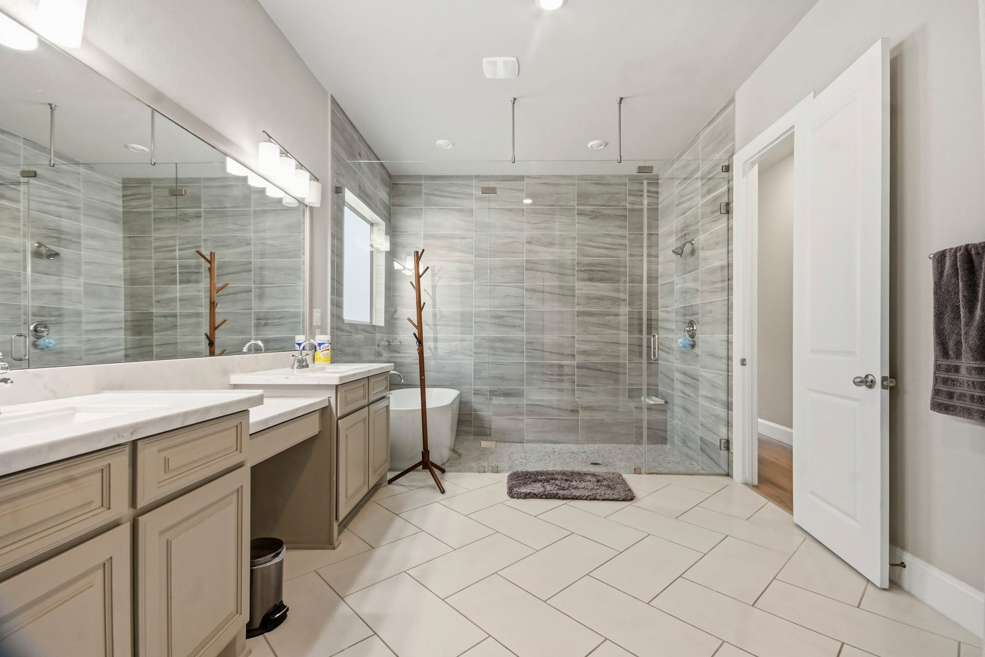 2511 Park Square Drive, Missouri City, TX 77459 Luxurious wet room combines a spacious shower and soaking tub for a relaxing, spa-like retreat.
