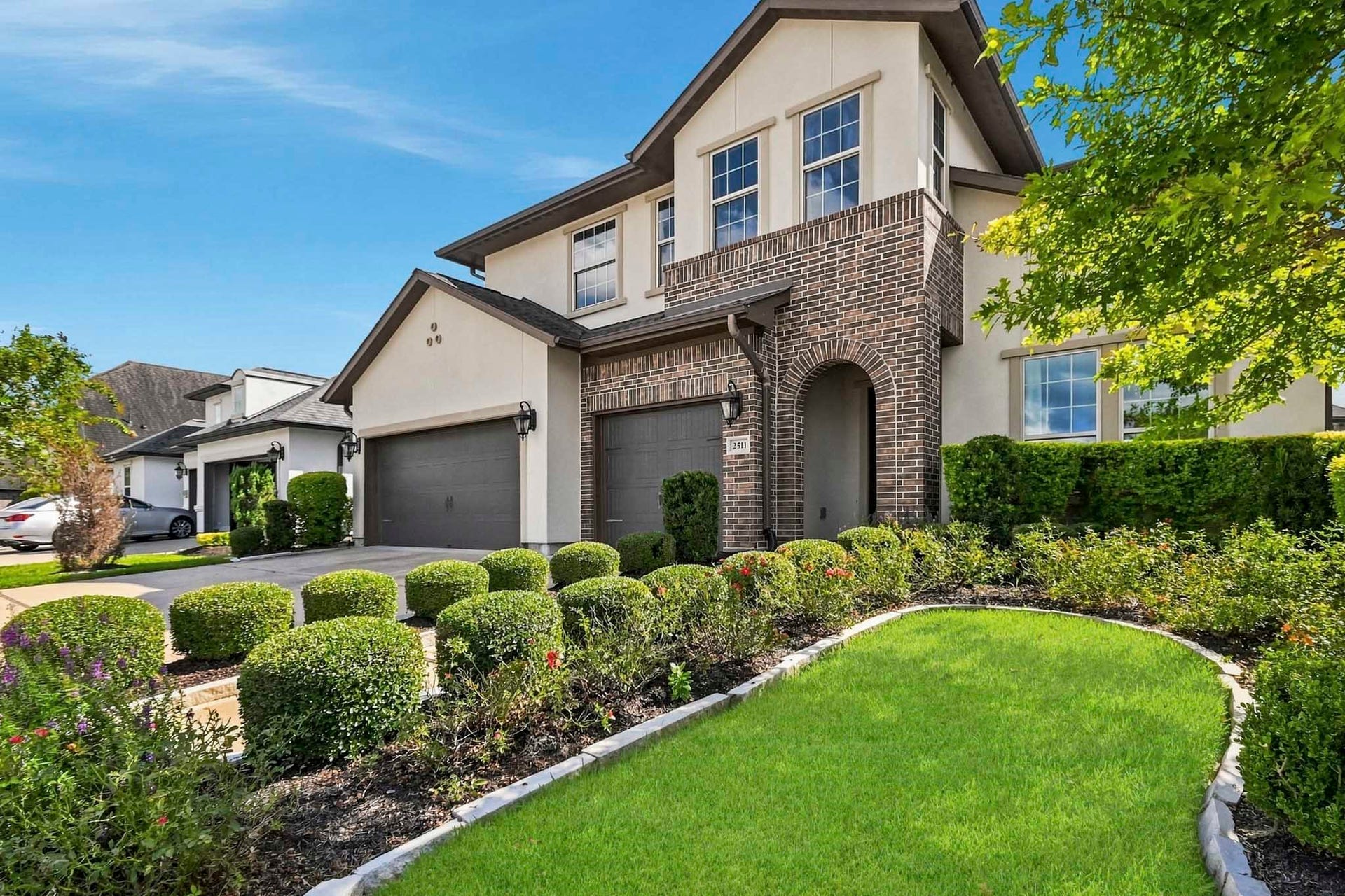 2511 Park Square Drive, Missouri City, TX 77459 Mature landscaping with brick-and-stucco exterior.