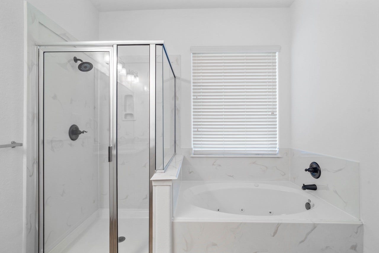 Primary bathroom has separate shower and bath
