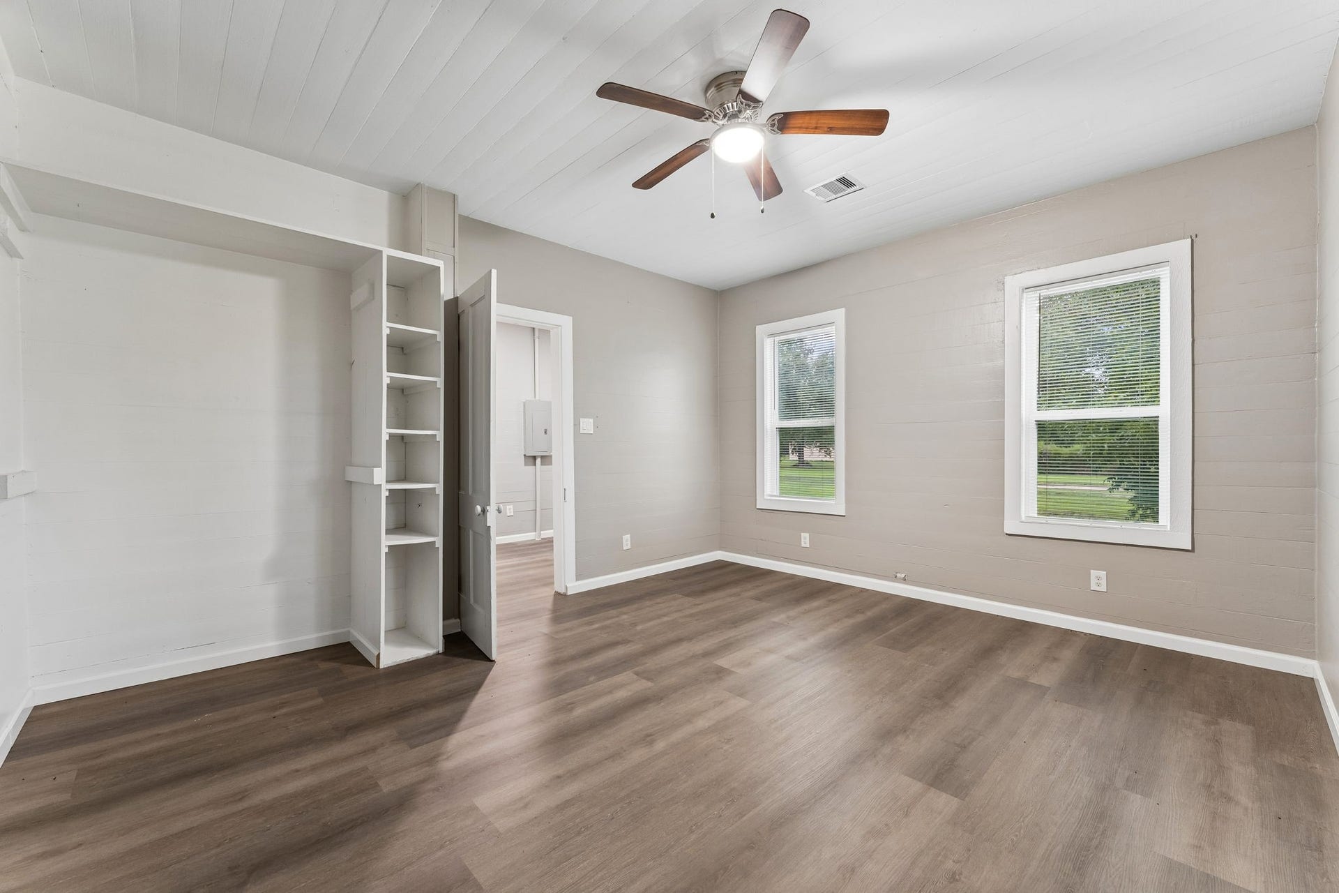 10534 Hufsmith Road, Tomball, TX 77375 Downstairs bedroom offers flexibility for family, guests, or a dedicated retreat while capturing the home's abundant natural light.