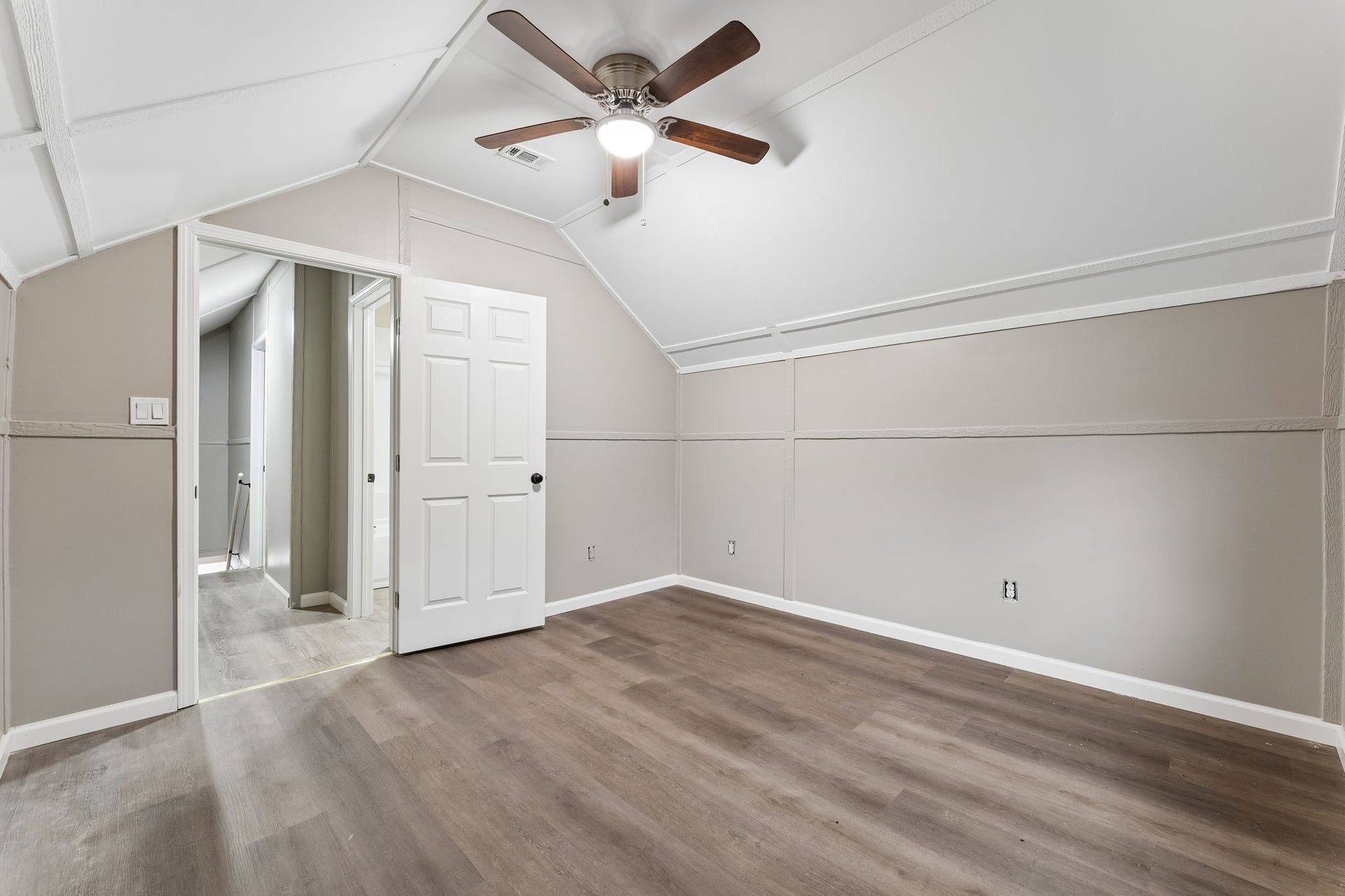 10534 Hufsmith Road, Tomball, TX 77375 Second view of the upstairs bedroom highlights the room's flexible layout, vaulted ceiling, and open floor space for future furnishings or personal touches.
