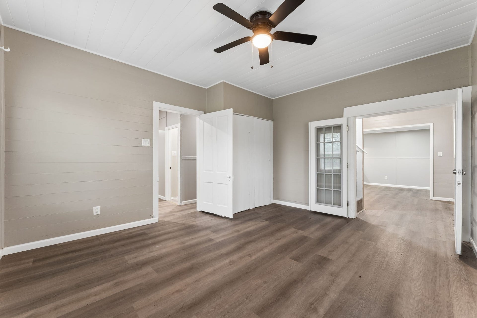 10534 Hufsmith Road, Tomball, TX 77375 Second view of living room view reveals the room's generous footprint and connection to the adjoining areasan inviting space for relaxed everyday living or entertaining.