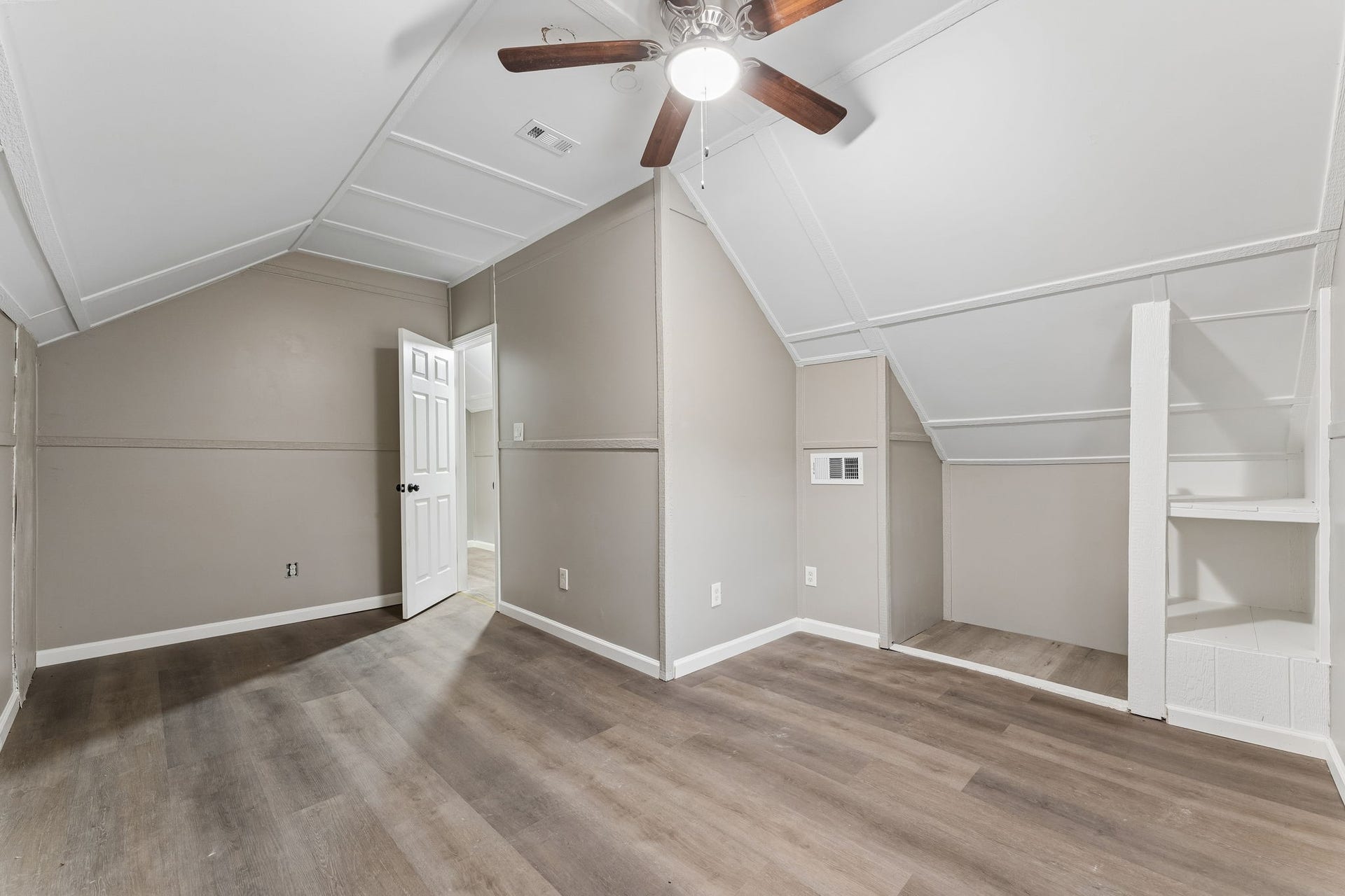 10534 Hufsmith Road, Tomball, TX 77375 Upper-level bedroom showcases the actual room dimensions, natural light, built-in features, and flexible space represented in the virtually staged image.