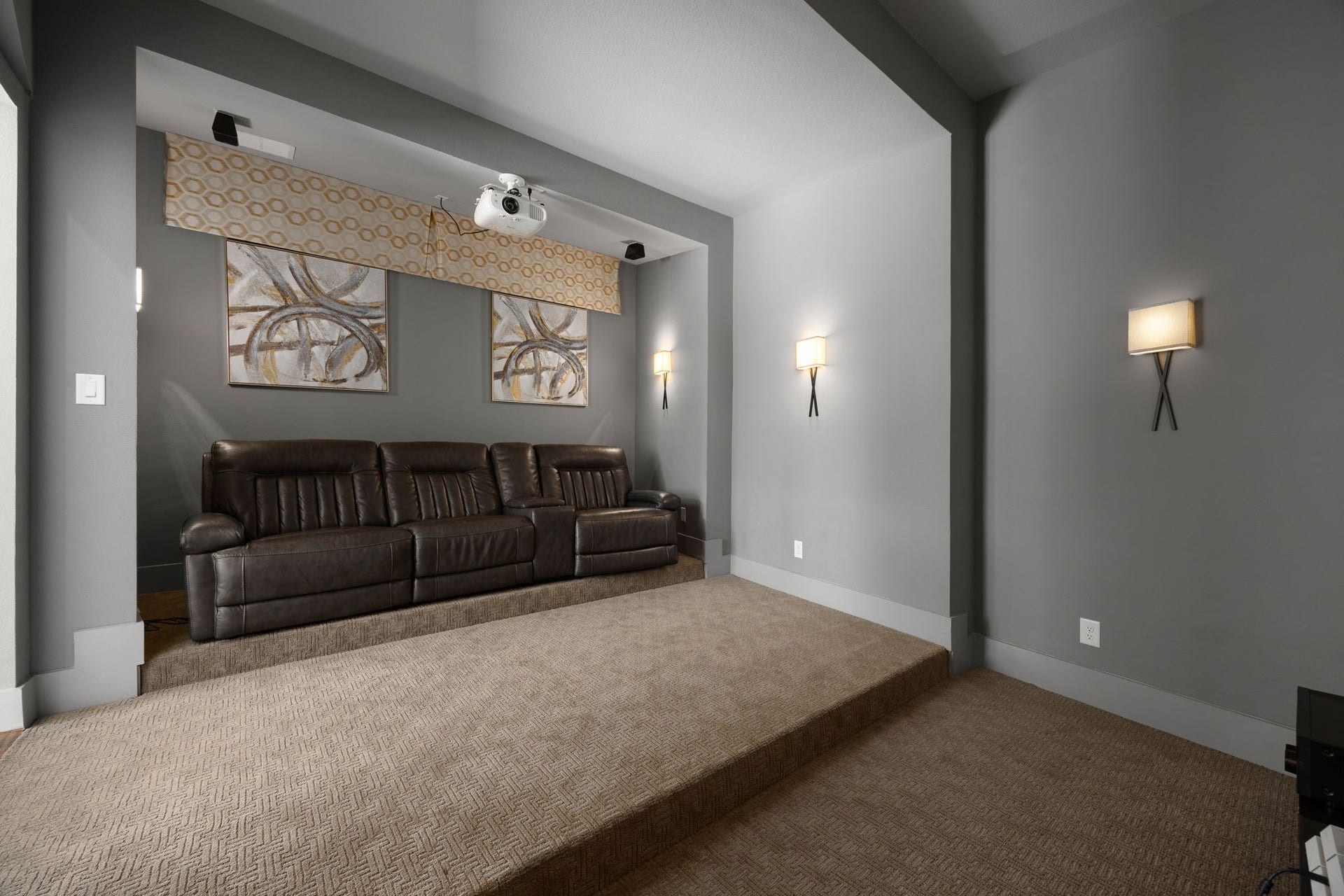 27927 Indigo Ridge Drive, Fulshear, TX 77441 Dedicated media room with stylish accent walls, accent lighting, and a theater-inspired seating levels.