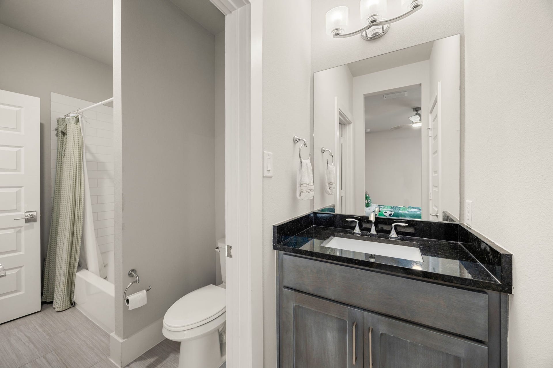 27927 Indigo Ridge Drive, Fulshear, TX 77441 Convenient secondary jack and jill bathroom featuring a modern vanity, attractive countertop, and functional layout.