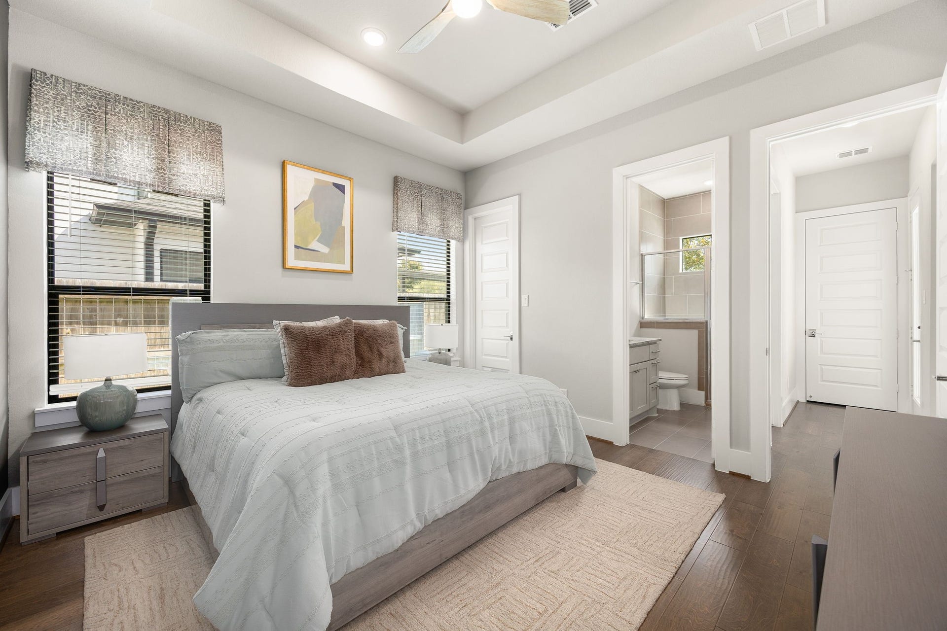 27927 Indigo Ridge Drive, Fulshear, TX 77441 Bright secondary downstairs bedroom featuring beautiful ceiling details, neutral colors, and generous natural light.
