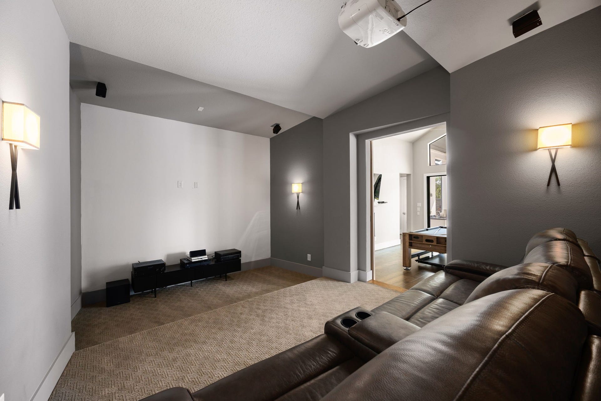 27927 Indigo Ridge Drive, Fulshear, TX 77441 Spacious media room featuring a cozy, inviting atmosphere, perfect for movie nights, watching your favorite shows, or relaxing with family and friends.
