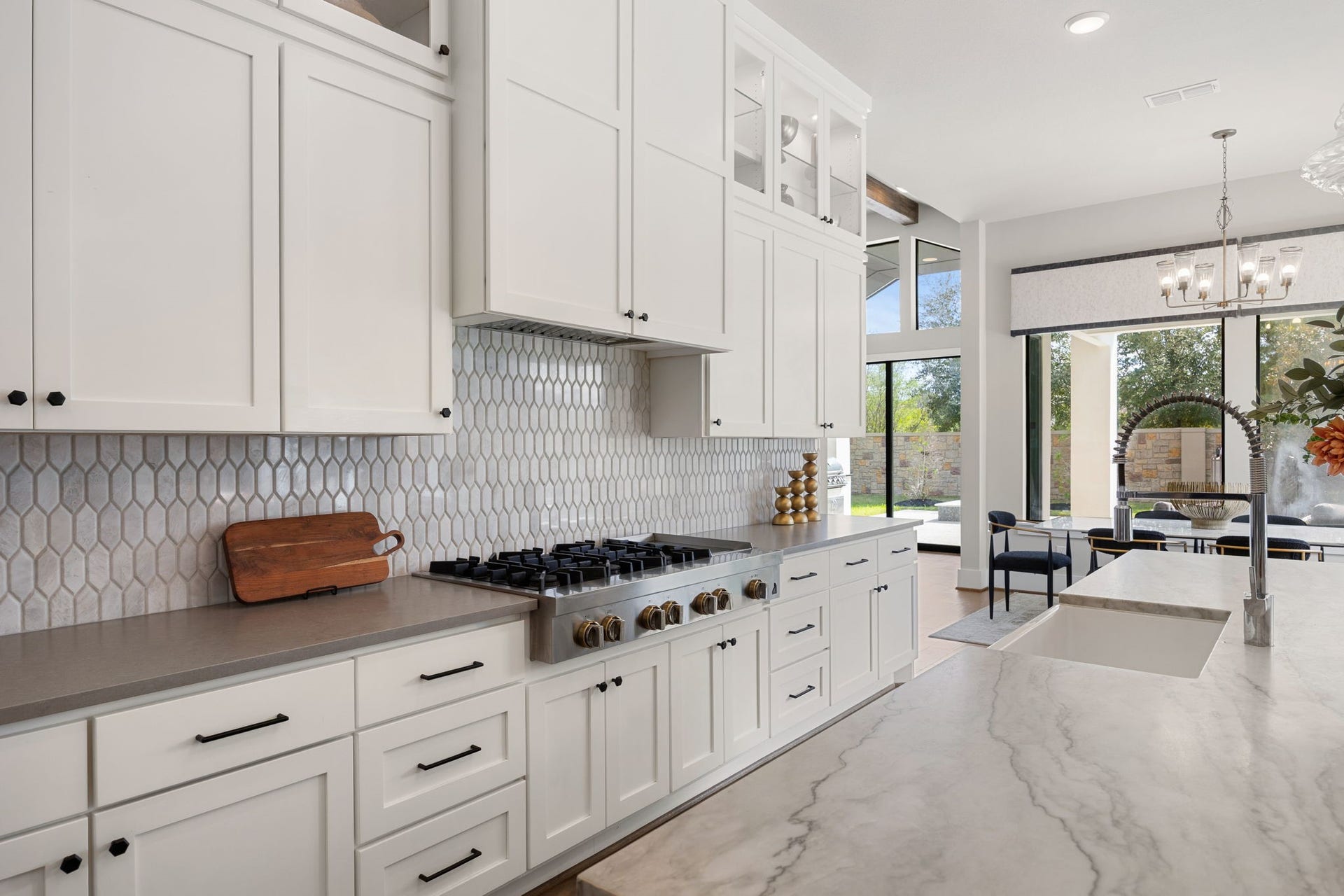 27927 Indigo Ridge Drive, Fulshear, TX 77441 Beautifully appointed kitchen offering abundant cabinetry, generous counter space, and views of the backyard.