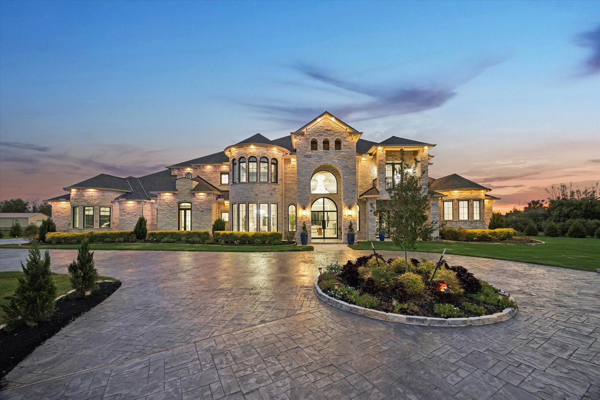 7826 Lakebrook Drive, Missouri City, TX 77459 Twilight front exterior - gated entry and circular motor court