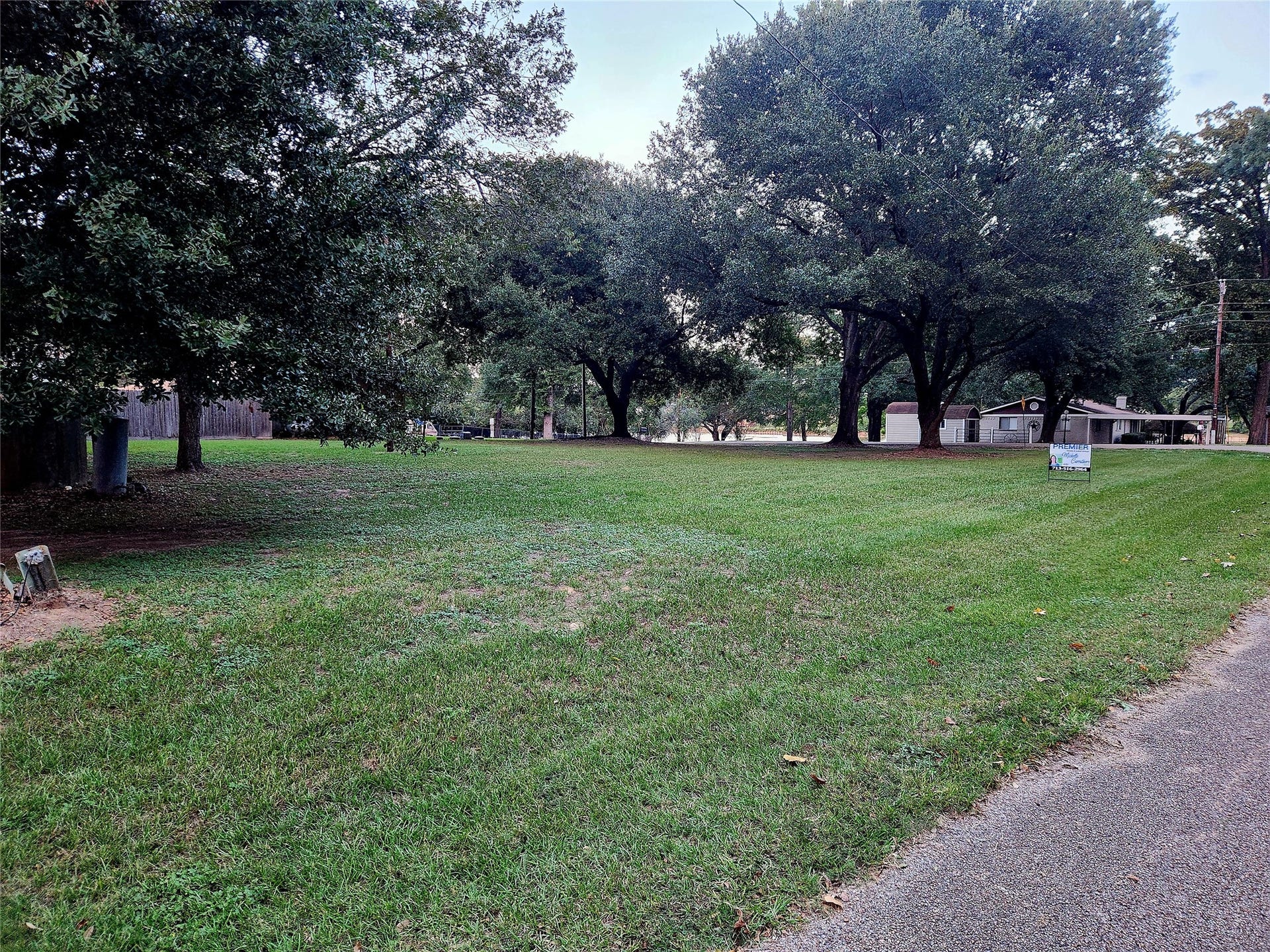 TBD Dream Point, Willis, TX 77318 View from left front facing the property towards the neighborhood park and Cozy Cover Lane. Huge lot! Plenty of room for a house and garage for lake toys.