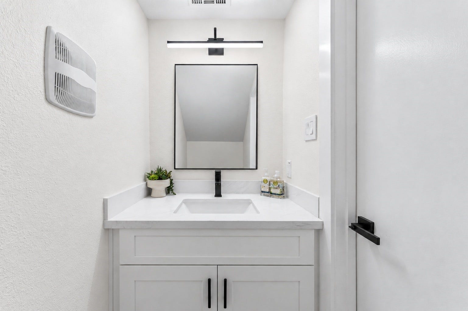 14387 Misty Meadow Lane, Houston, TX 77079 The half bathroom has been updated with new quartz countertops, new cabinets, and a new toilet!