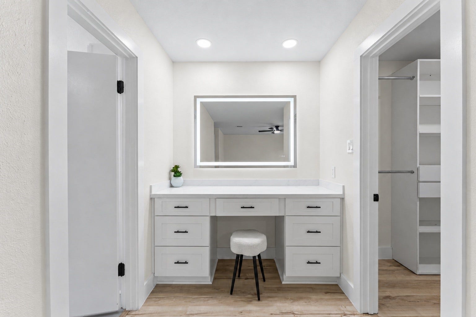 14387 Misty Meadow Lane, Houston, TX 77079 The primary bedroom has a luxury vanity between the walk in closet and the bathroom