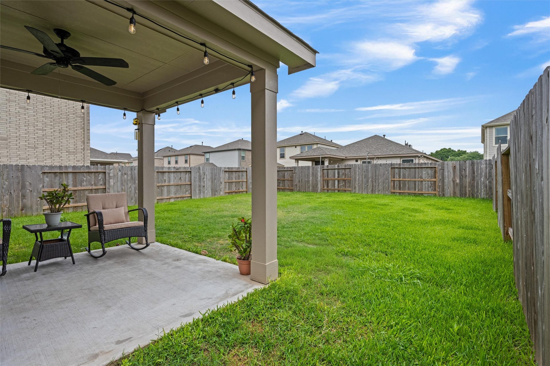 2873 Shimmer Edge Drive, Katy, TX 77493 The patio offers a shaded retreat overlooking the backyard, perfect for relaxing or hosting gatherings.