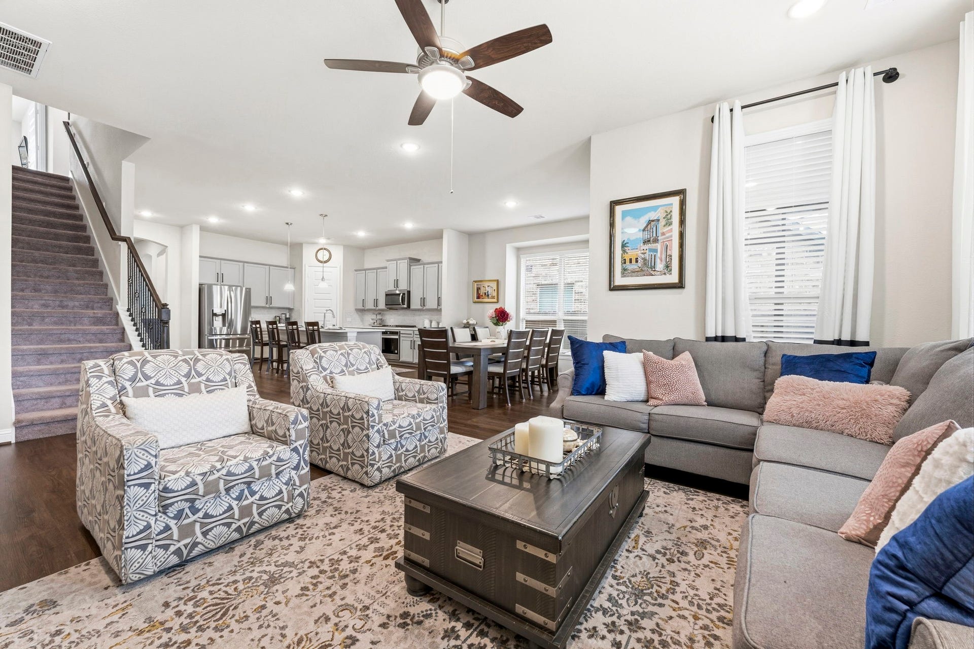 17209 Olive Blossom Court, Conroe, TX 77385 Spacious family room open to the kitchen and dining area, creating a comfortable and connected layout for everyday living.