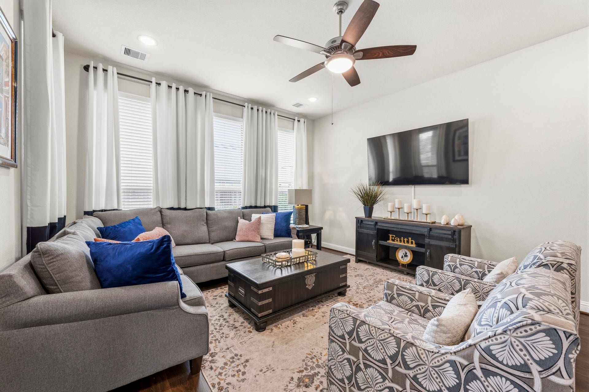 17209 Olive Blossom Court, Conroe, TX 77385 Comfortable living area ideal for relaxing or enjoying a movie, offering a cozy yet spacious place to unwind.