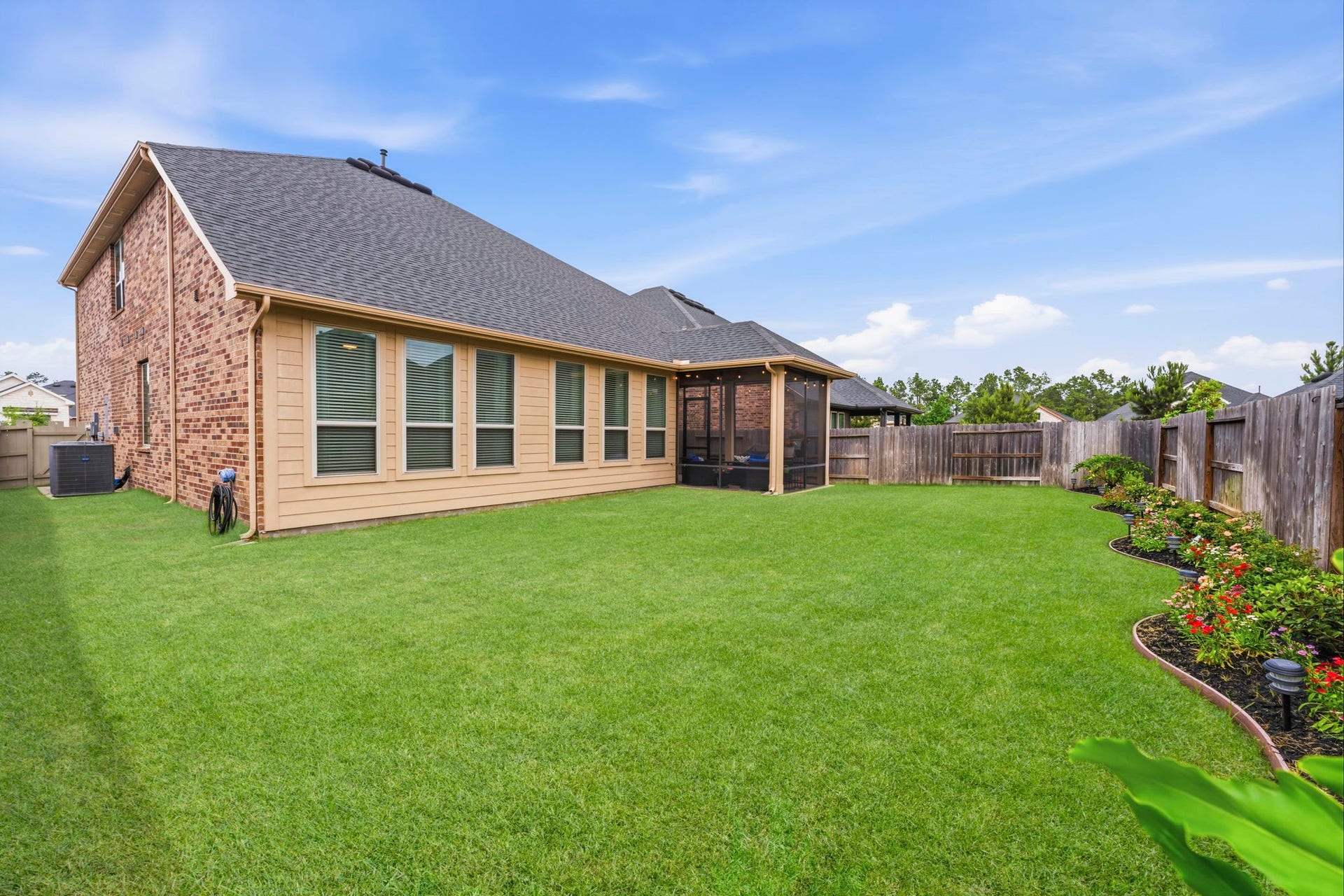 17209 Olive Blossom Court, Conroe, TX 77385 Fenced backyard with space for pets and play, completing a home thats truly a wonderful place to call home.
