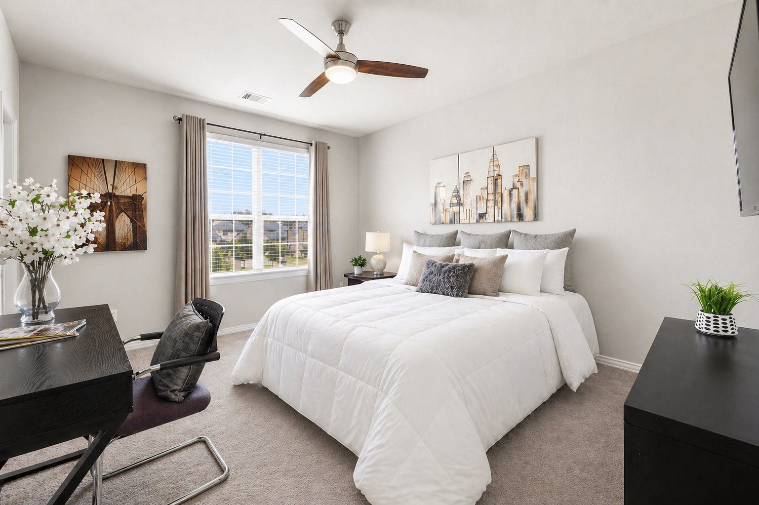 17209 Olive Blossom Court, Conroe, TX 77385 Another spacious secondary bedroom with a large walk-in closet, ceiling fan, and natural light, offering flexibility for a variety of uses.