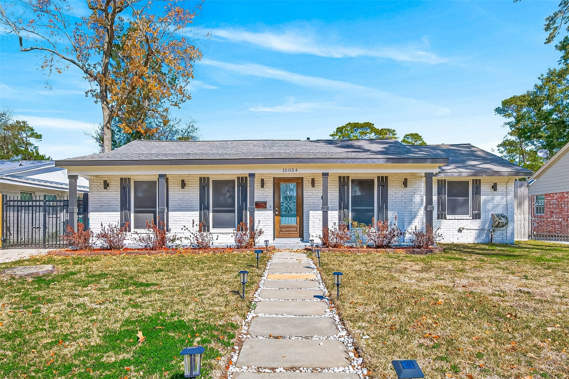10054 Cedardale Drive, Houston, TX 77055 Charming single-story home with a welcoming front porch and well-maintained landscaping.